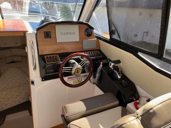 2025 Cutwater C-248 C Coupe interior with Garmin navigation and steering wheel.