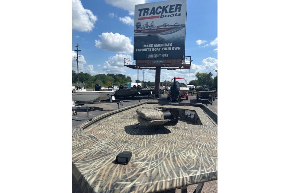 2026 Tracker Grizzly 1654 T Sportsman boat displayed outdoors under a clear sky.