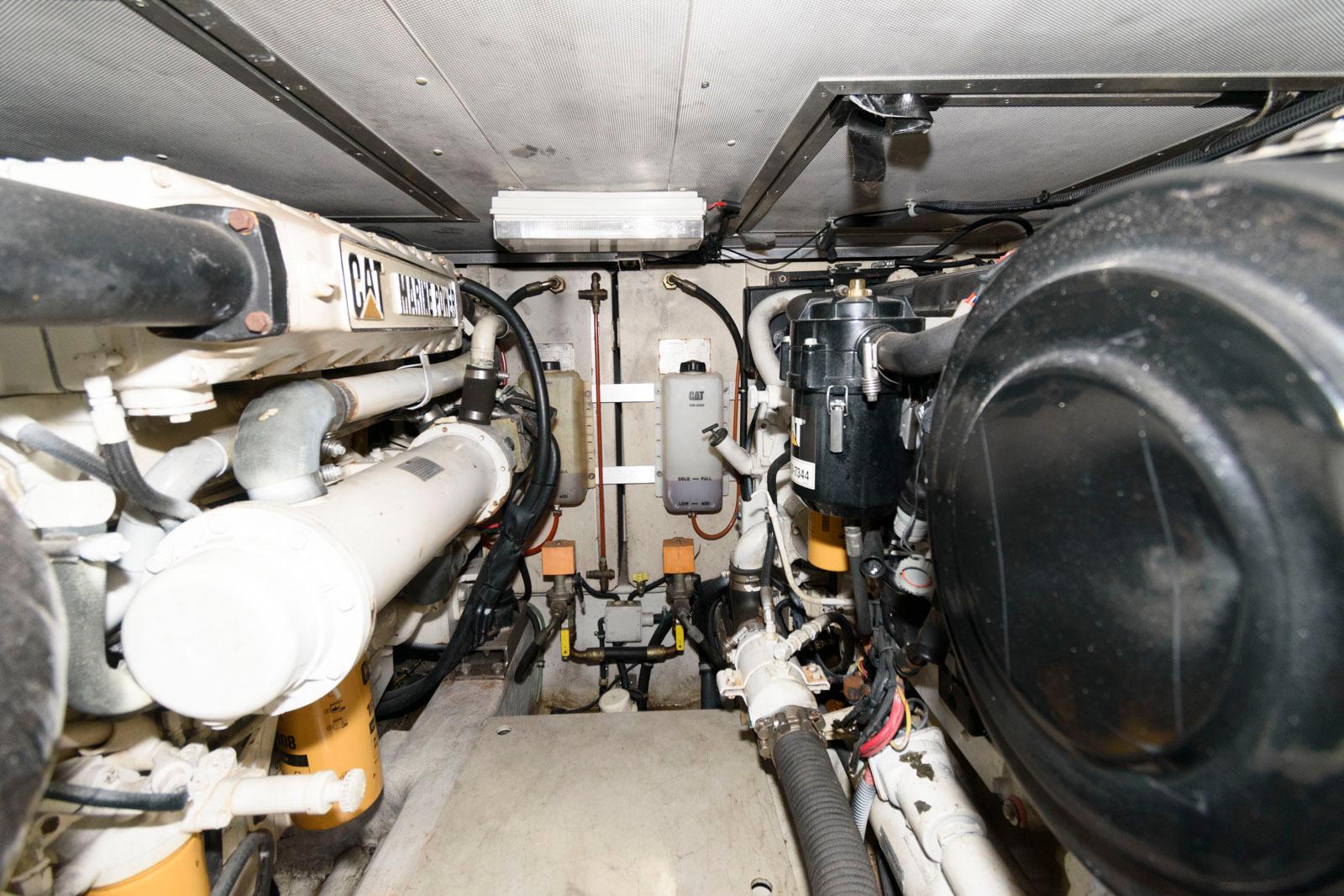 Engine room of 2005 Azimut 50 Flybridge yacht, featuring Caterpillar machinery.