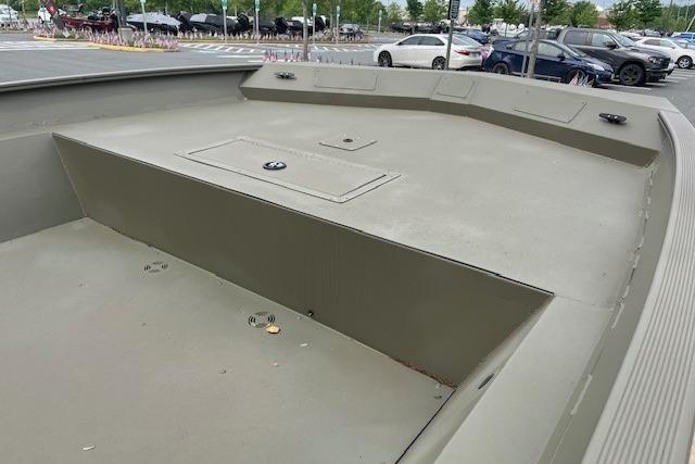 2025 Tracker Grizzly 2072 Utility boat, front deck view outdoors.