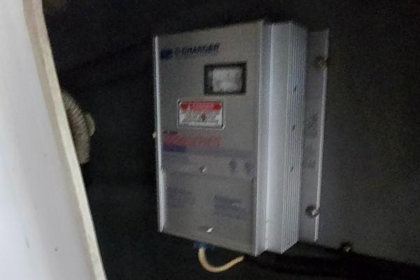 Battery charger in a 1999 Sea Ray 280 SS boat interior.