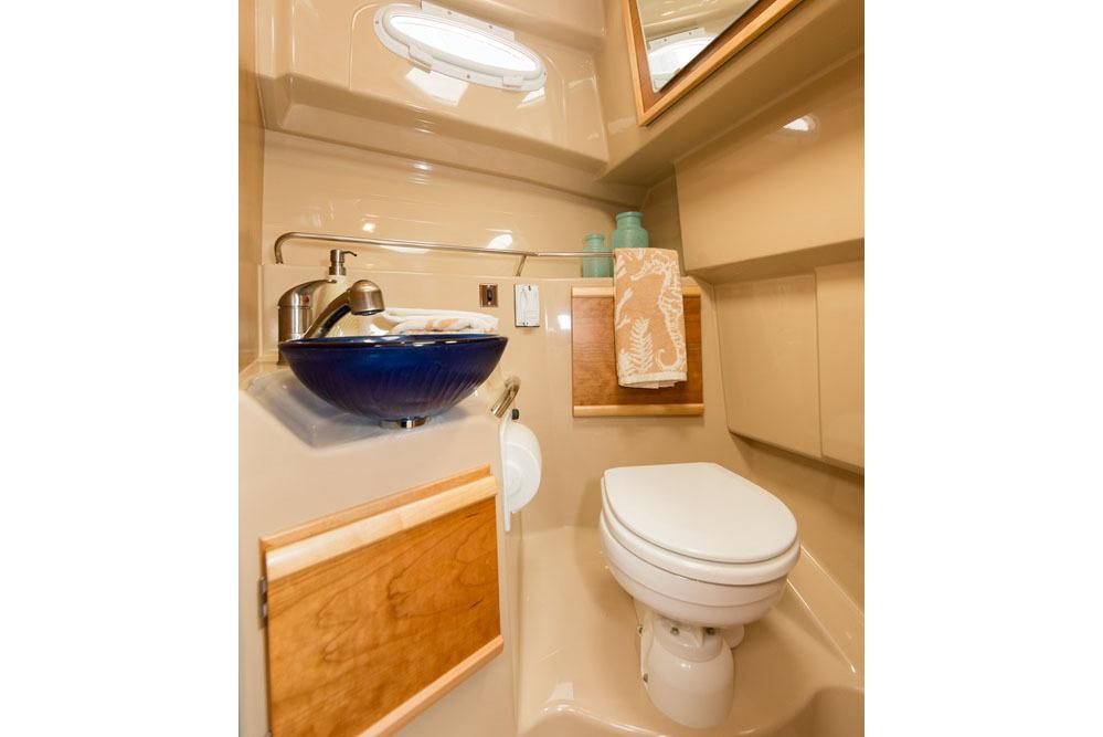 Manufacturer Provided Image: 2016 Cutwater 28 boat bathroom with modern sink and toilet.
