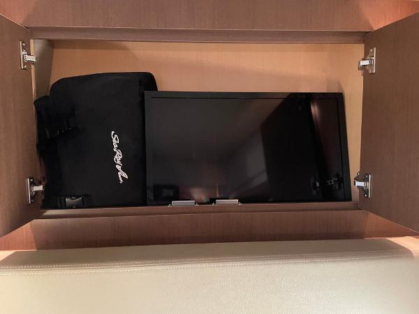 Cabinet with TV and Sea Ray bag on 2014 Sea Ray 330 Sundancer yacht.