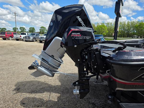 Outboard motor on a 2025 Nitro ZV-20 SPORT boat, parked outdoors.