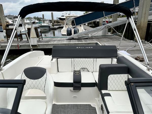 2022 Bayliner DX 2050 boat interior with seating, docked at marina.