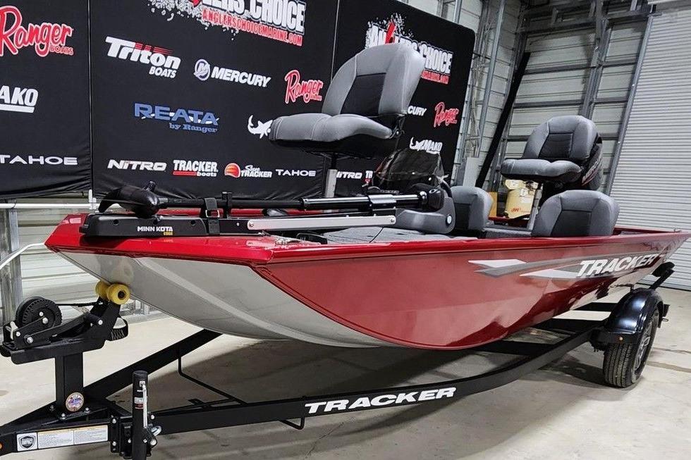 2026 Tracker Pro 170 boat in showroom, red exterior, on trailer.