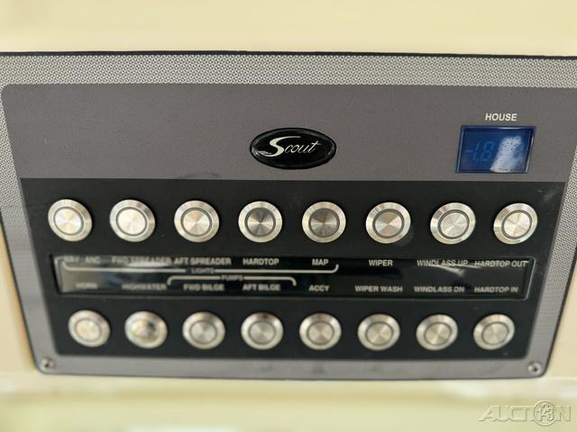Control panel of a 2022 Scout 330 LXF boat with various buttons and digital display.