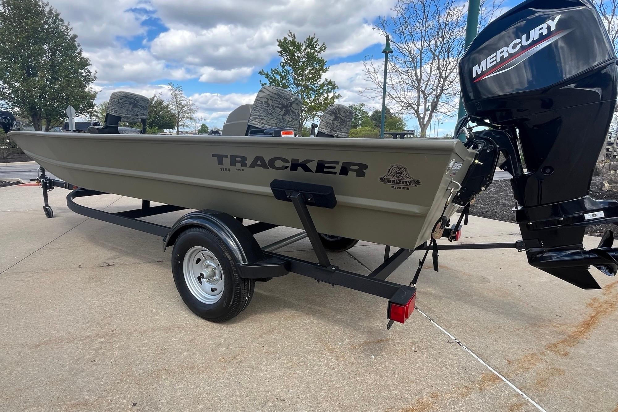 2026 Tracker Grizzly 1754 SC boat with Mercury engine on trailer, outdoors.