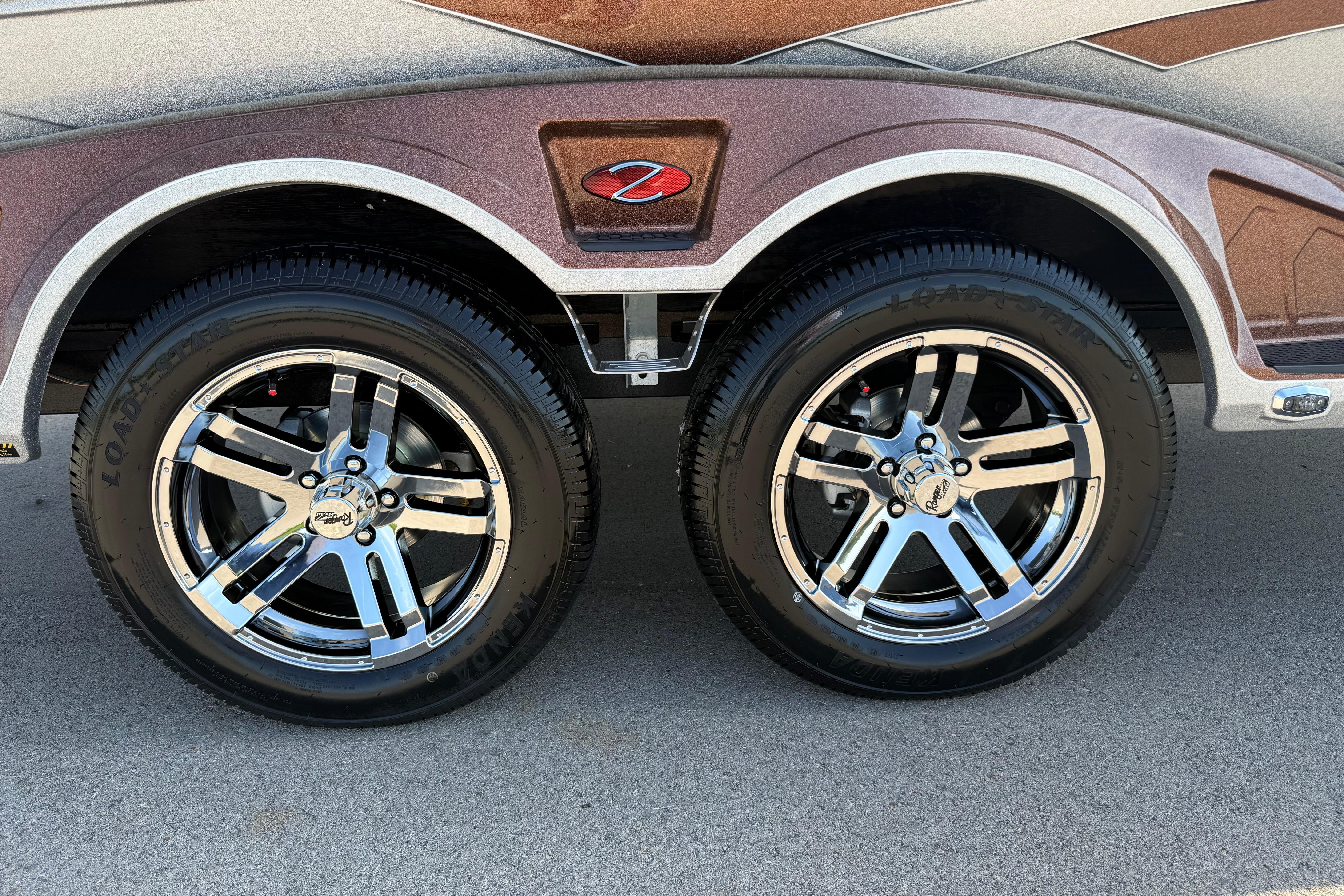 2026 Ranger Z521R trailer with shiny chrome wheels and sleek design.