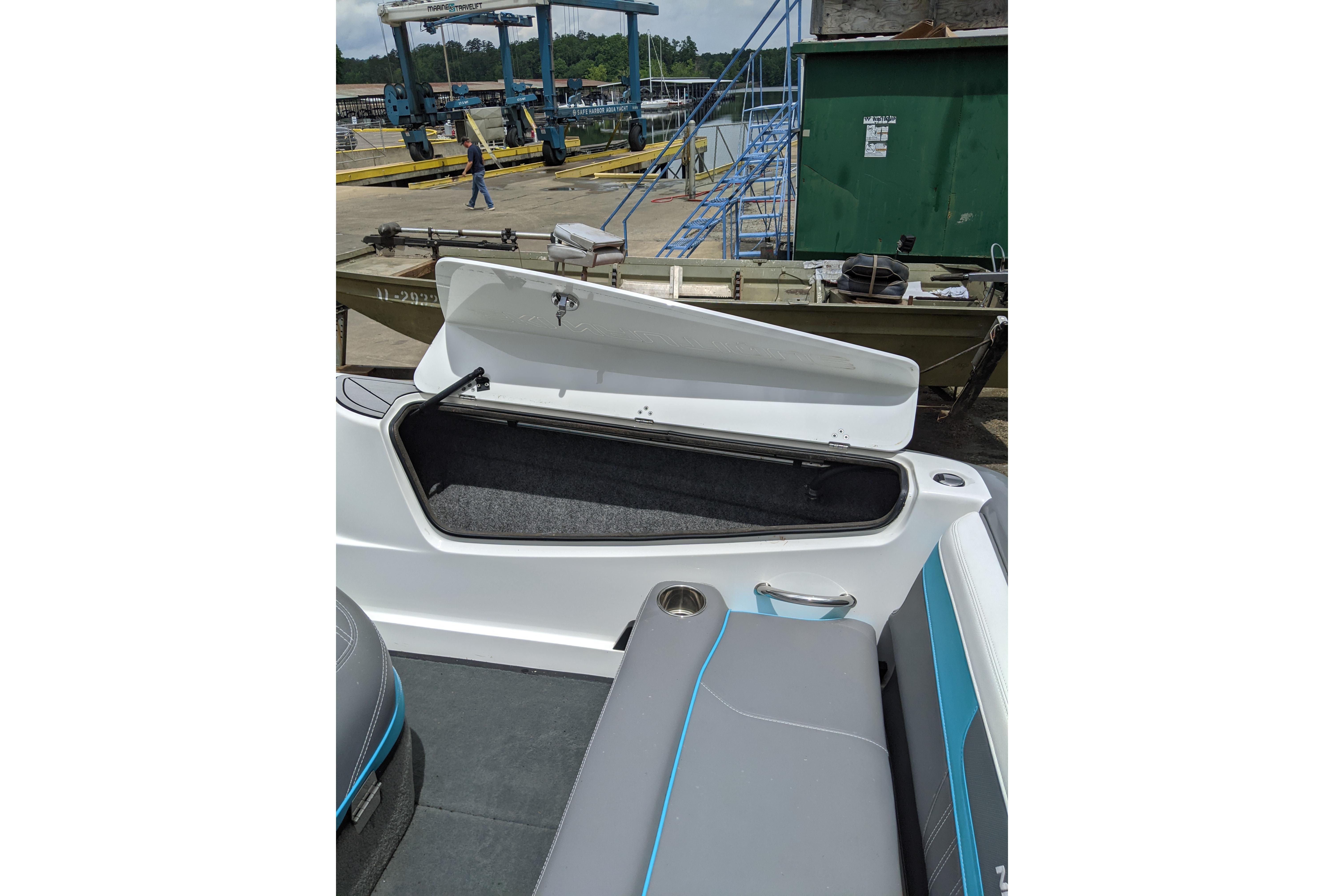 2016 Nautique Ski Nautique 200 Closed Bow interior with open storage compartment.