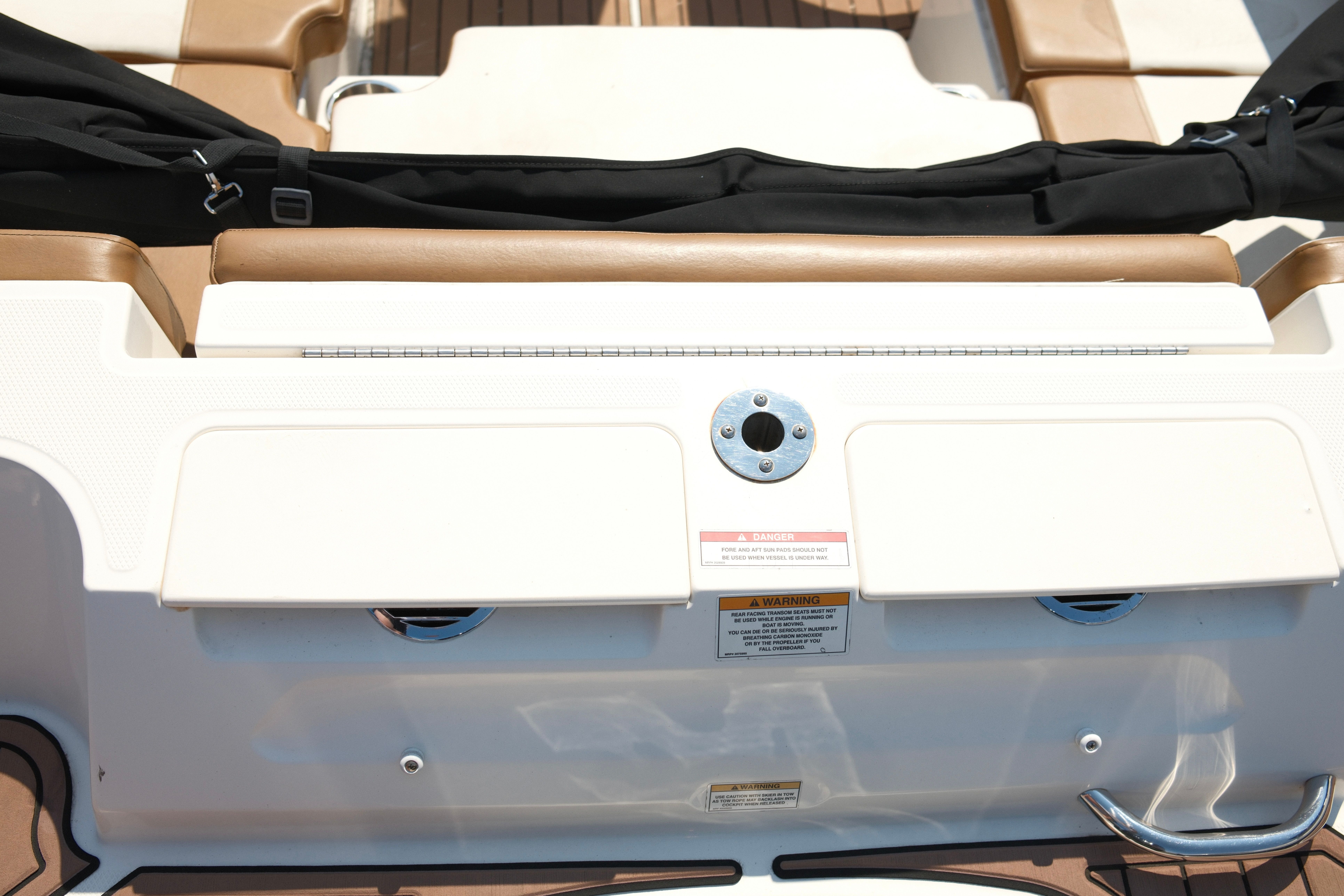 Rear view of a 2019 Bayliner VR4 Bowrider OB with brown and white seating.