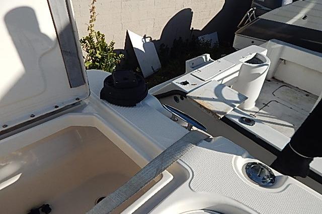 2003 World Cat 270 EC boat interior with open compartments and seating area.