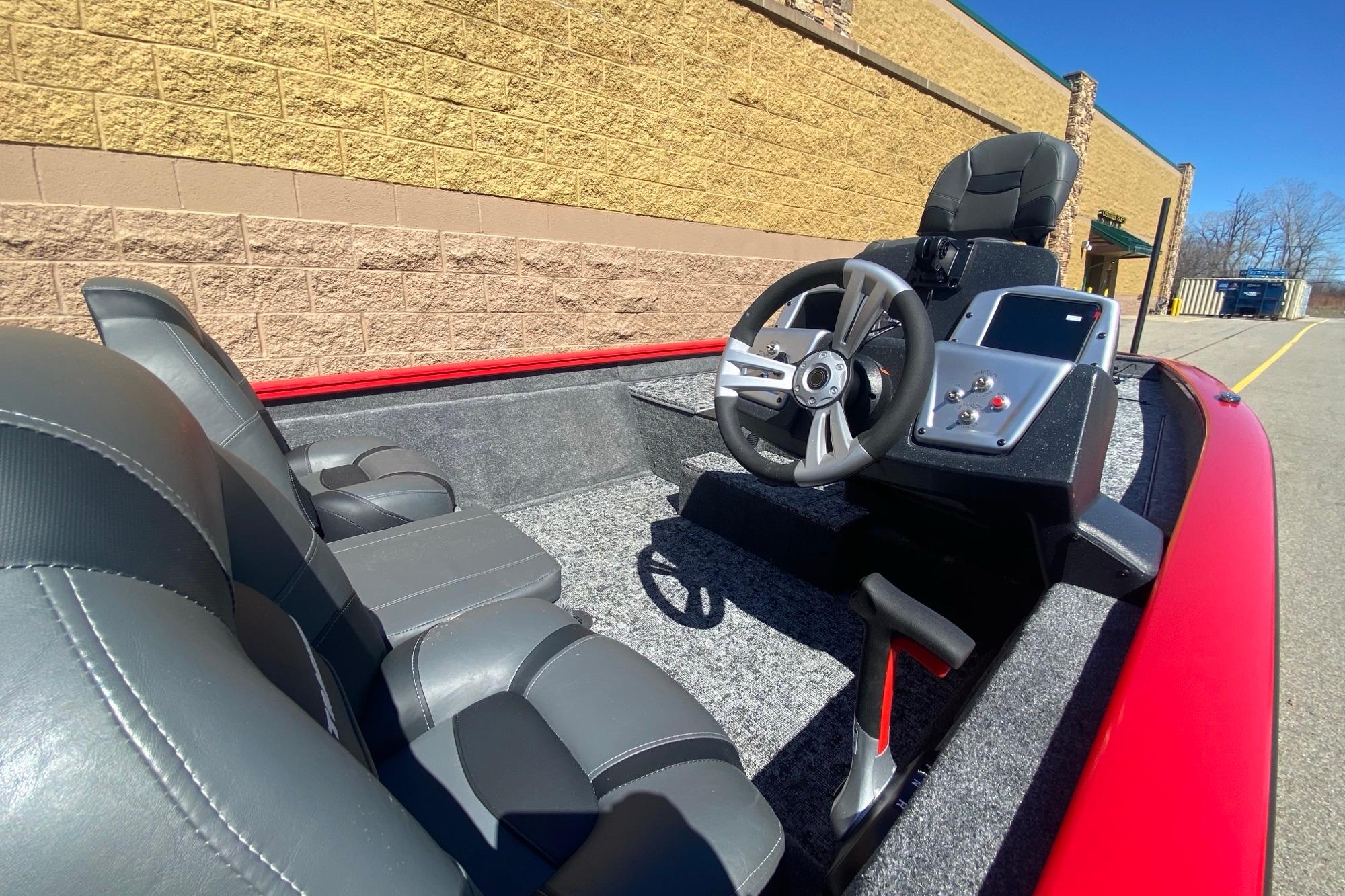 2026 Tracker Pro Team 175 boat interior with steering wheel and seats.
