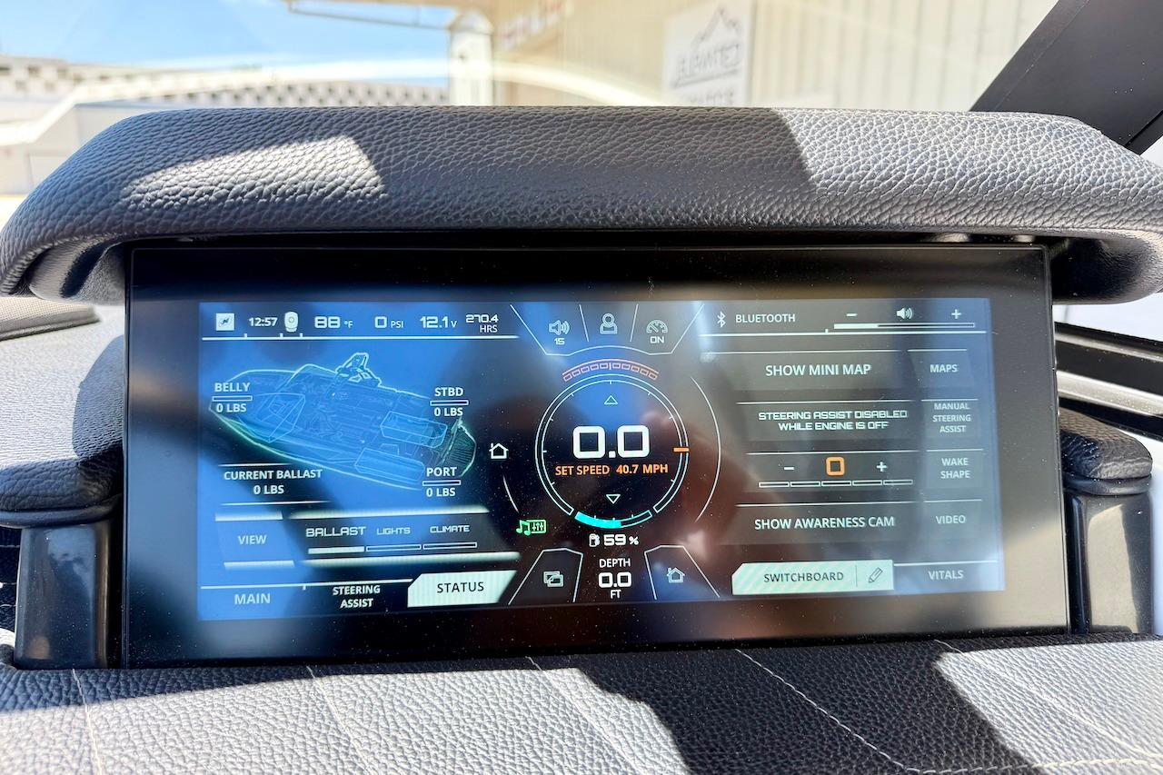Dashboard display of a 2021 Nautique Super Air Nautique G23 boat, showing controls and settings.