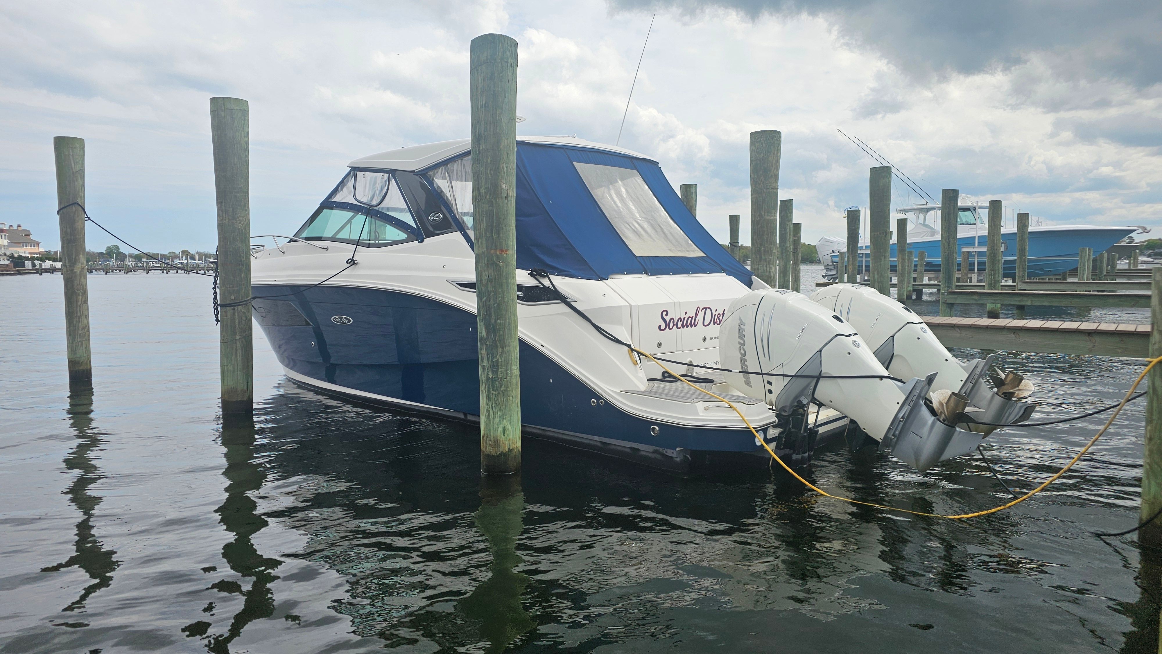 2020 Sea Ray Sundancer 320 Outboard docked at marina.