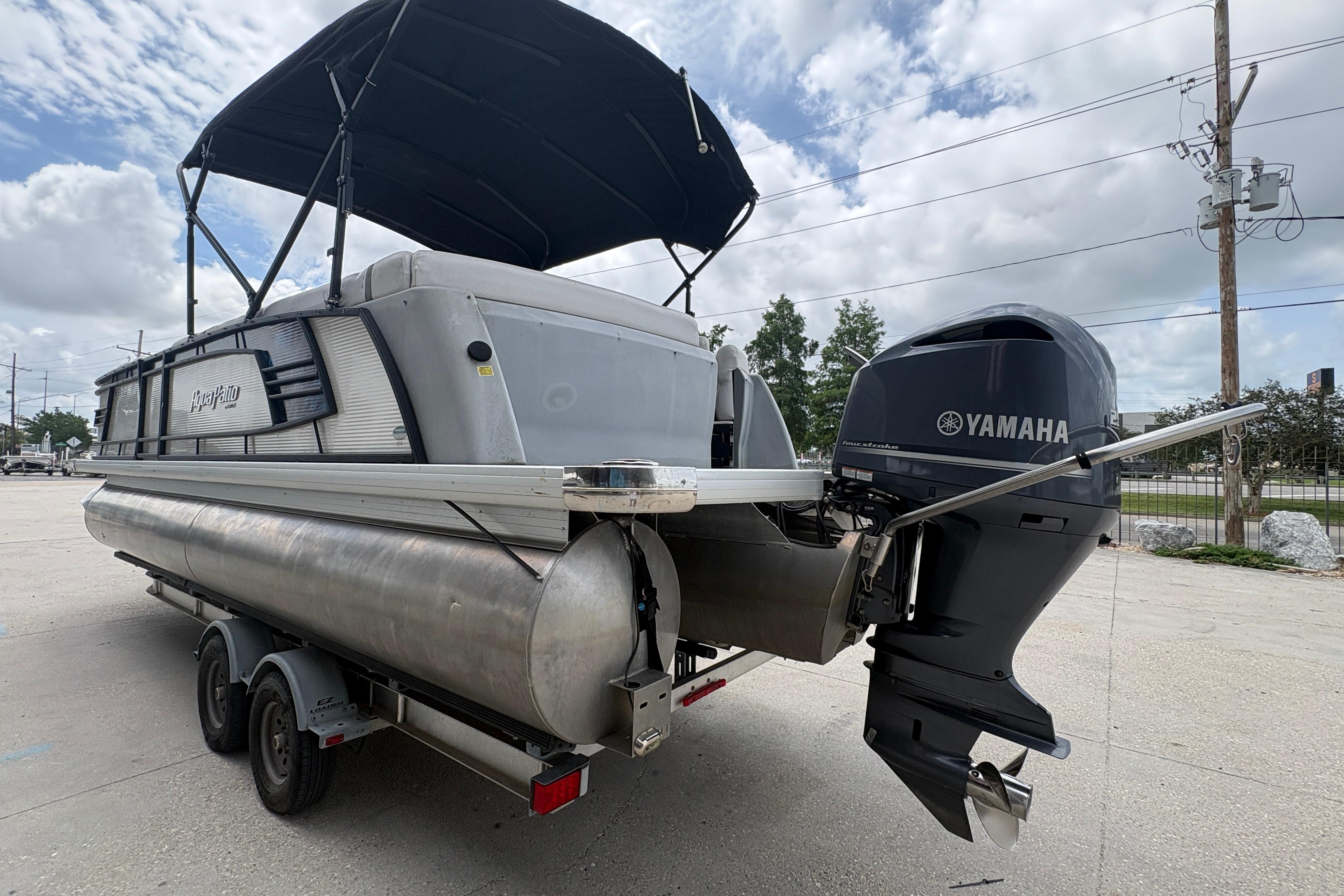 2019 Godfrey Aqua Patio pontoon boat with Yamaha outboard motor on a trailer.