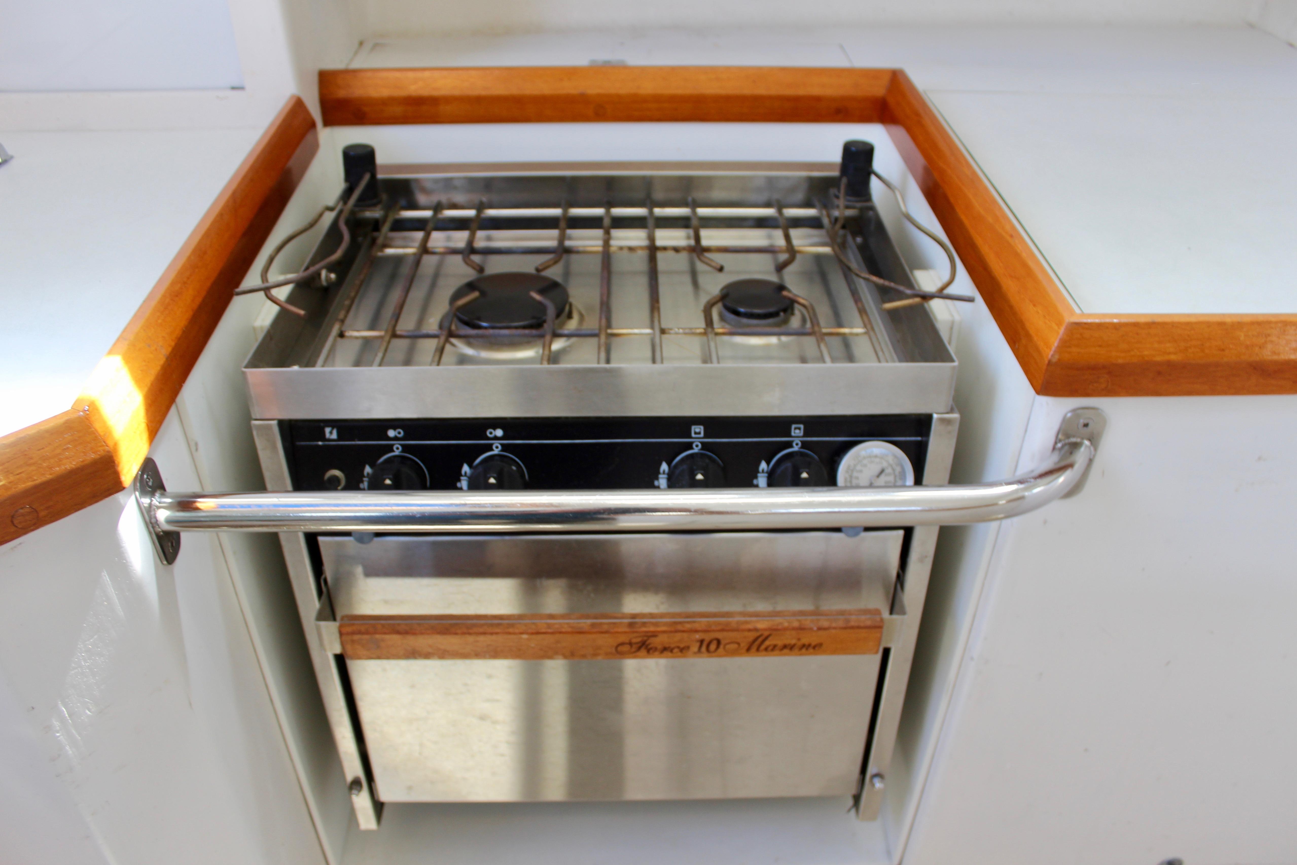 Stainless steel marine stove in a 1993 Freya 39 yacht kitchen.