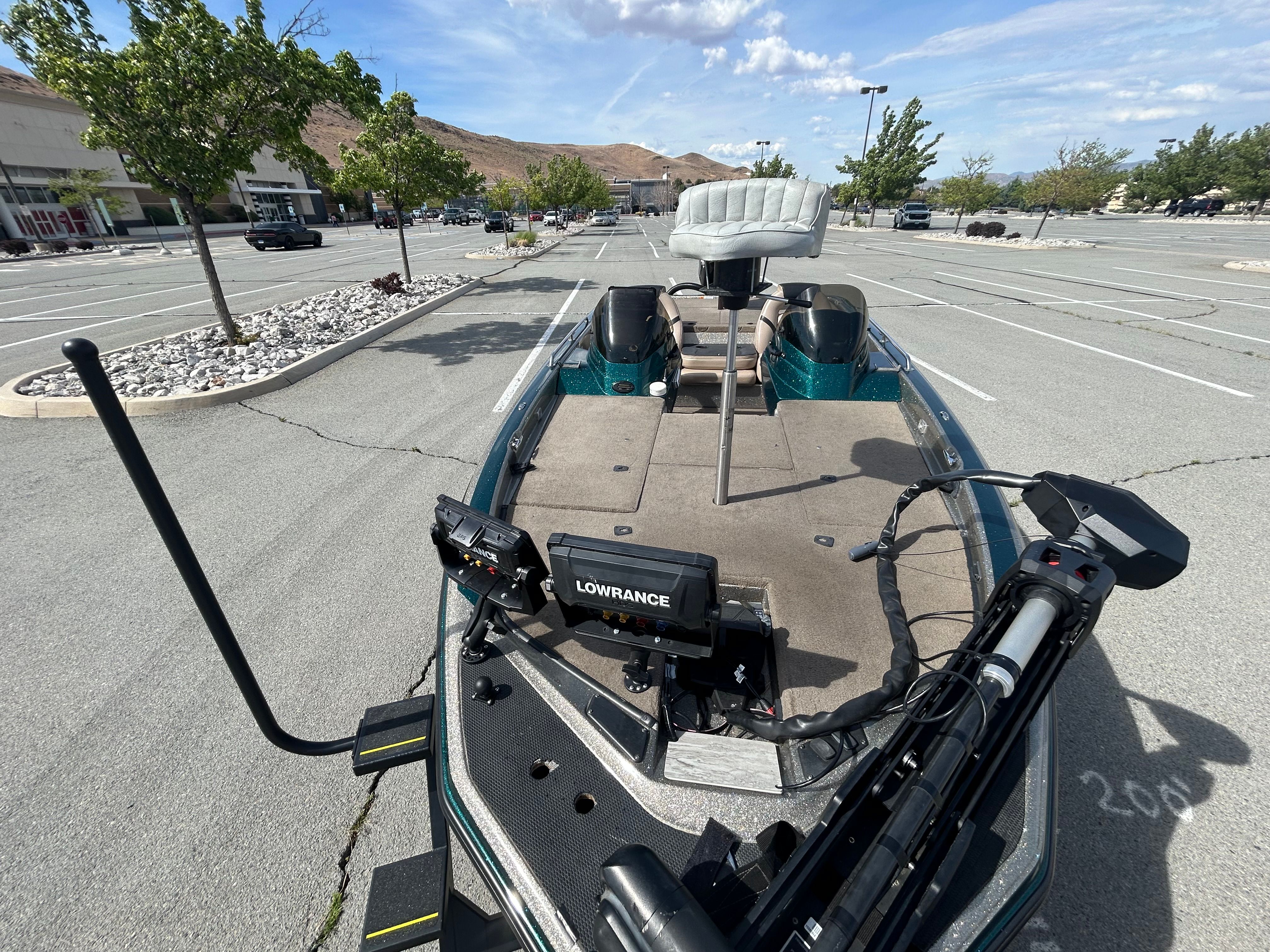 Champion 183 boat from 2008 in a parking lot.
