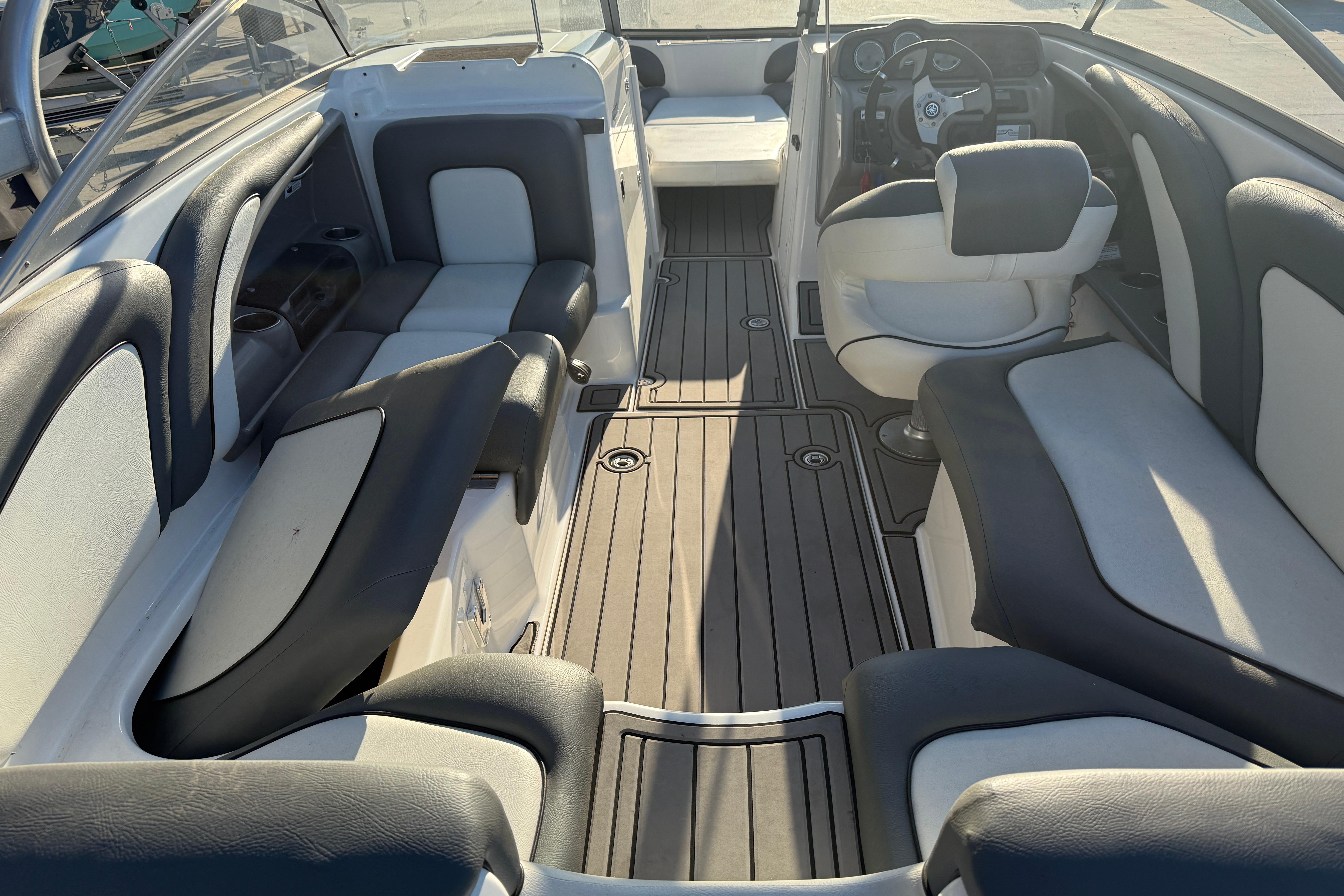 Interior of a 2011 Yamaha Boats 242 Limited S, featuring sleek seating and modern design.