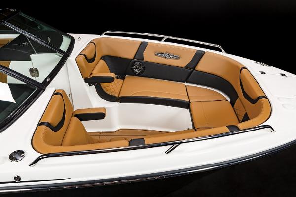 Luxurious interior of 2024 Chaparral 28 Surf boat with tan and black seating.