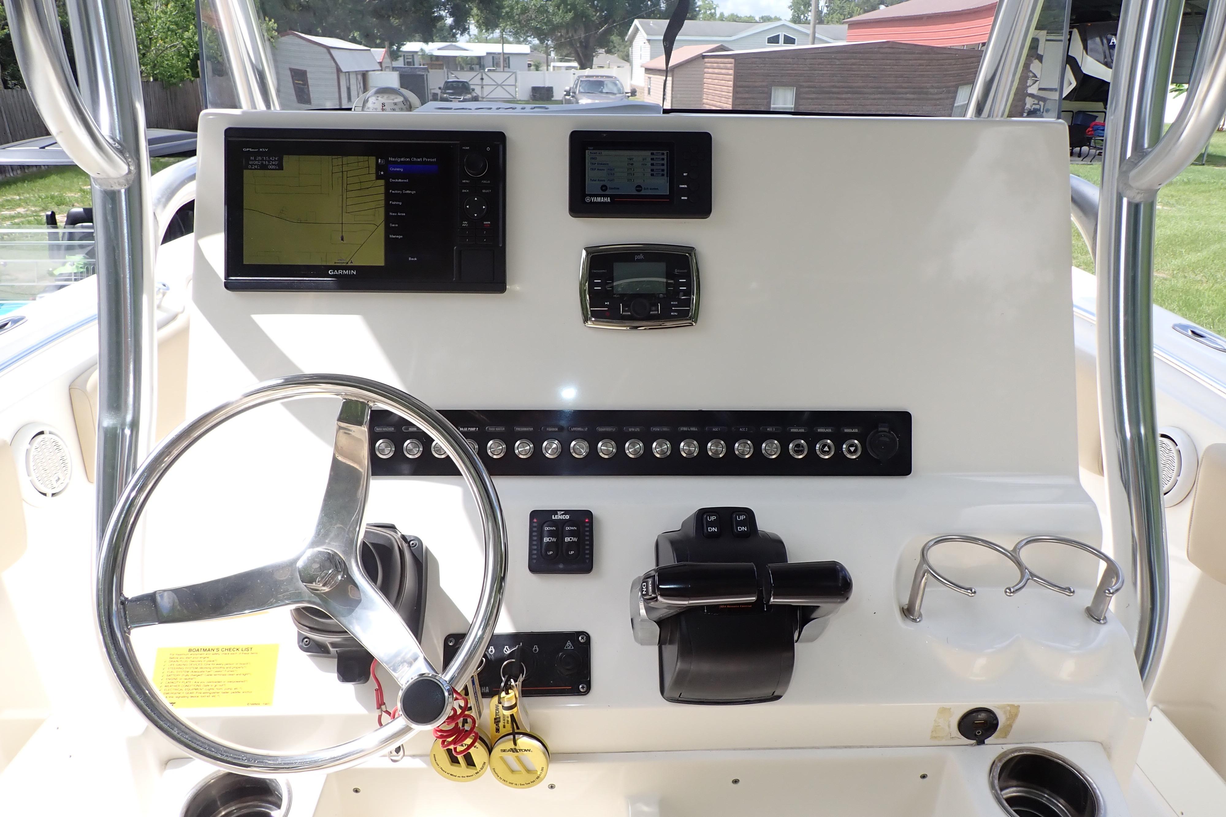 2019 Key West 263 FS boat dashboard with steering wheel, navigation screens, and controls.