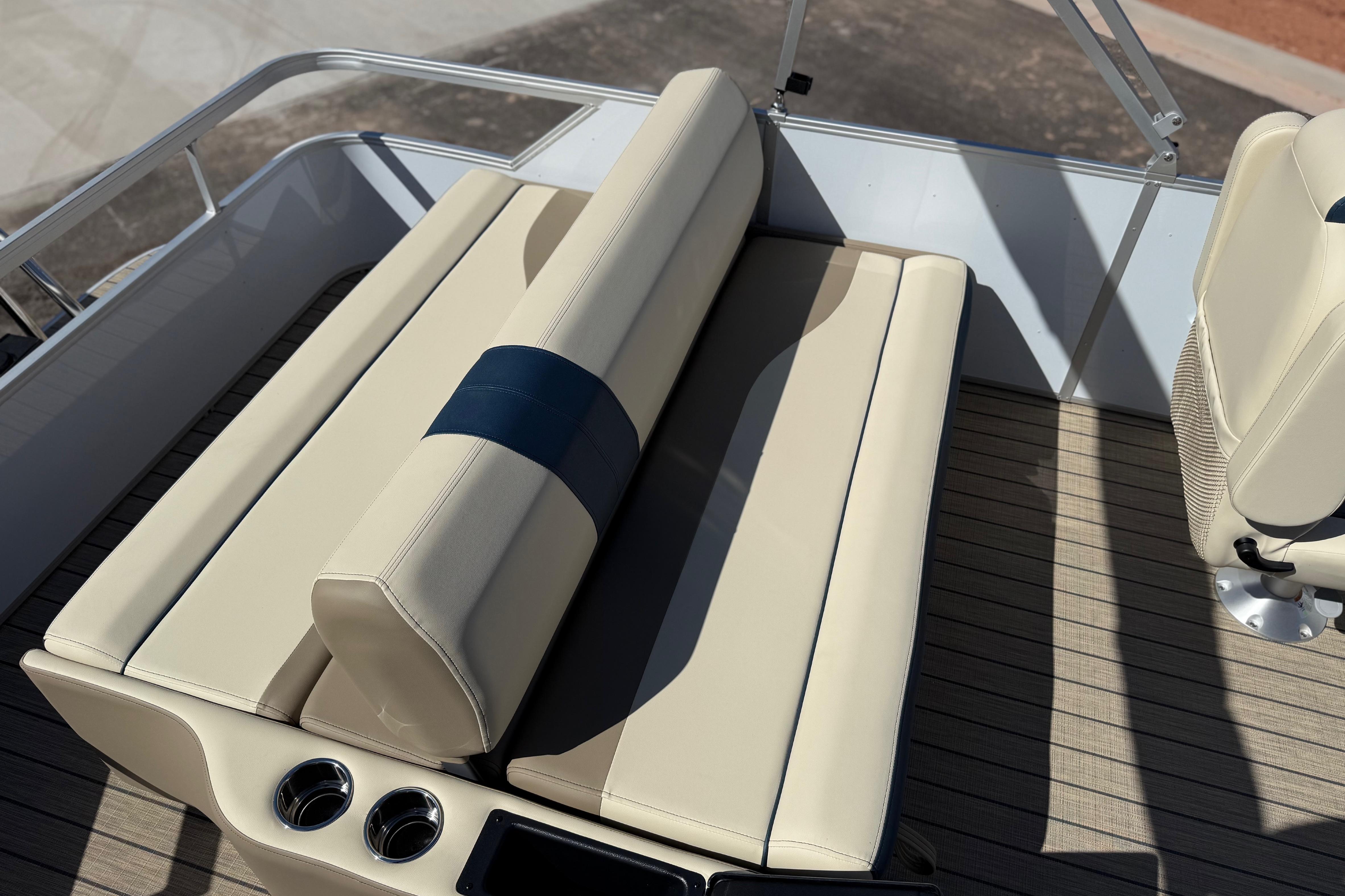 SunCatcher Select 322SL 2026 boat interior with beige seating and cup holders.
