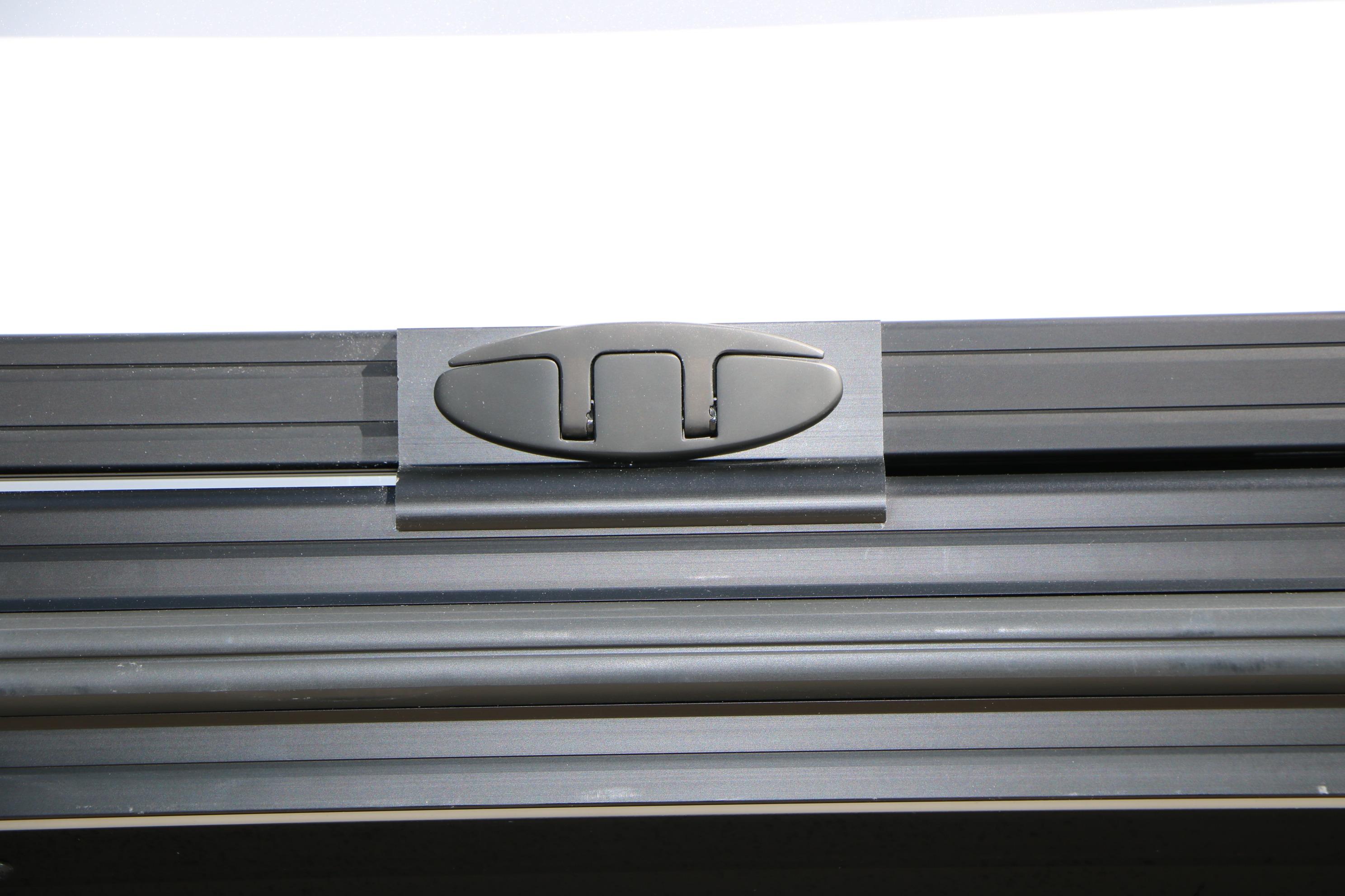 Close-up of Evotti 725 CS Tri-Toon 2026 boat component, featuring sleek black metal design.
