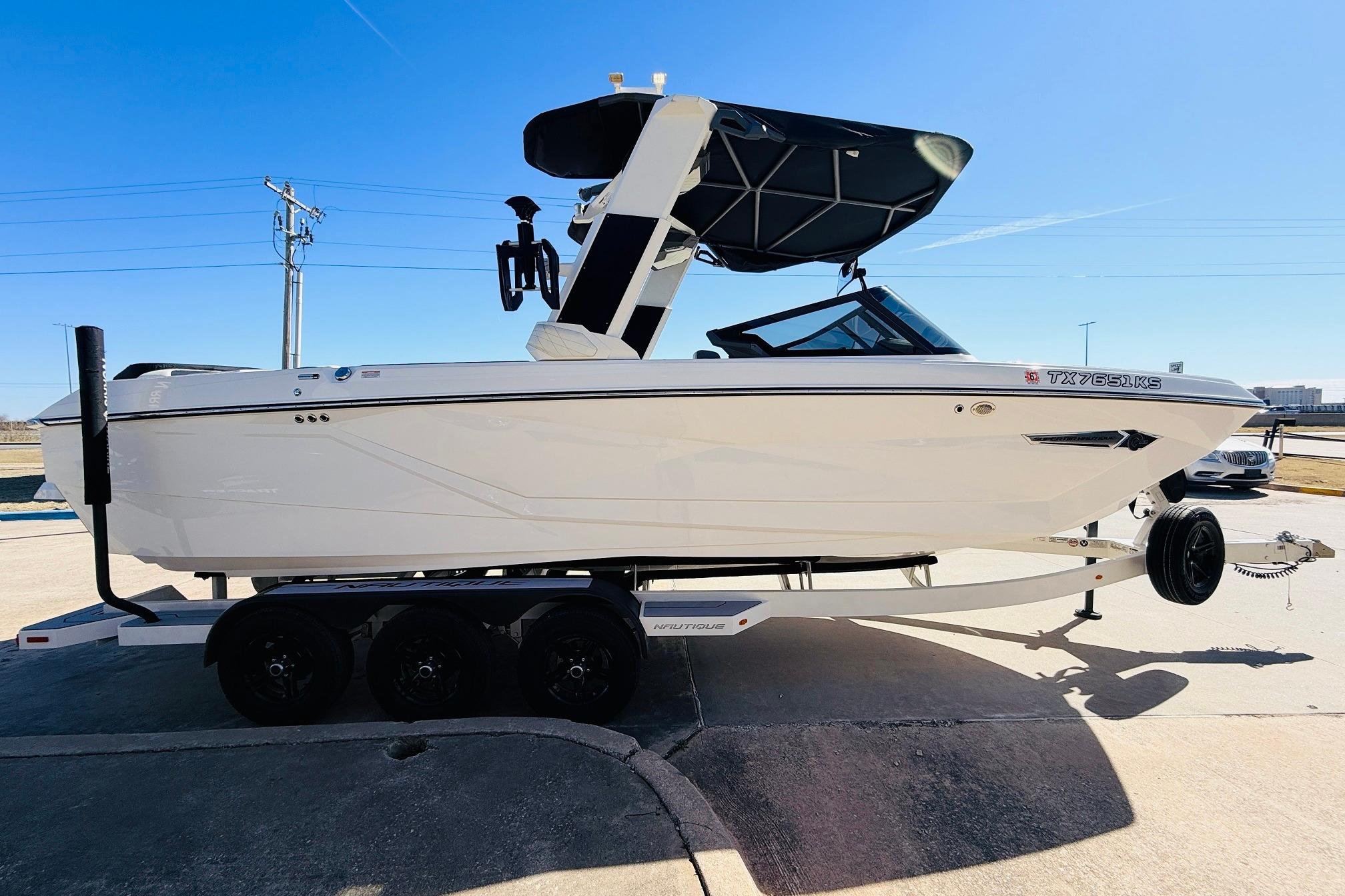2023 Nautique Super Air Nautique G25 boat on trailer, sunny day.