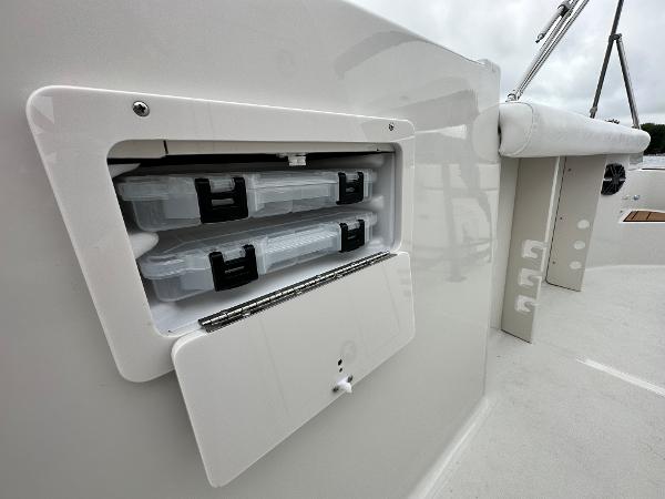 2025 Starcraft SVX 211 OB CC boat storage compartment with tackle boxes.