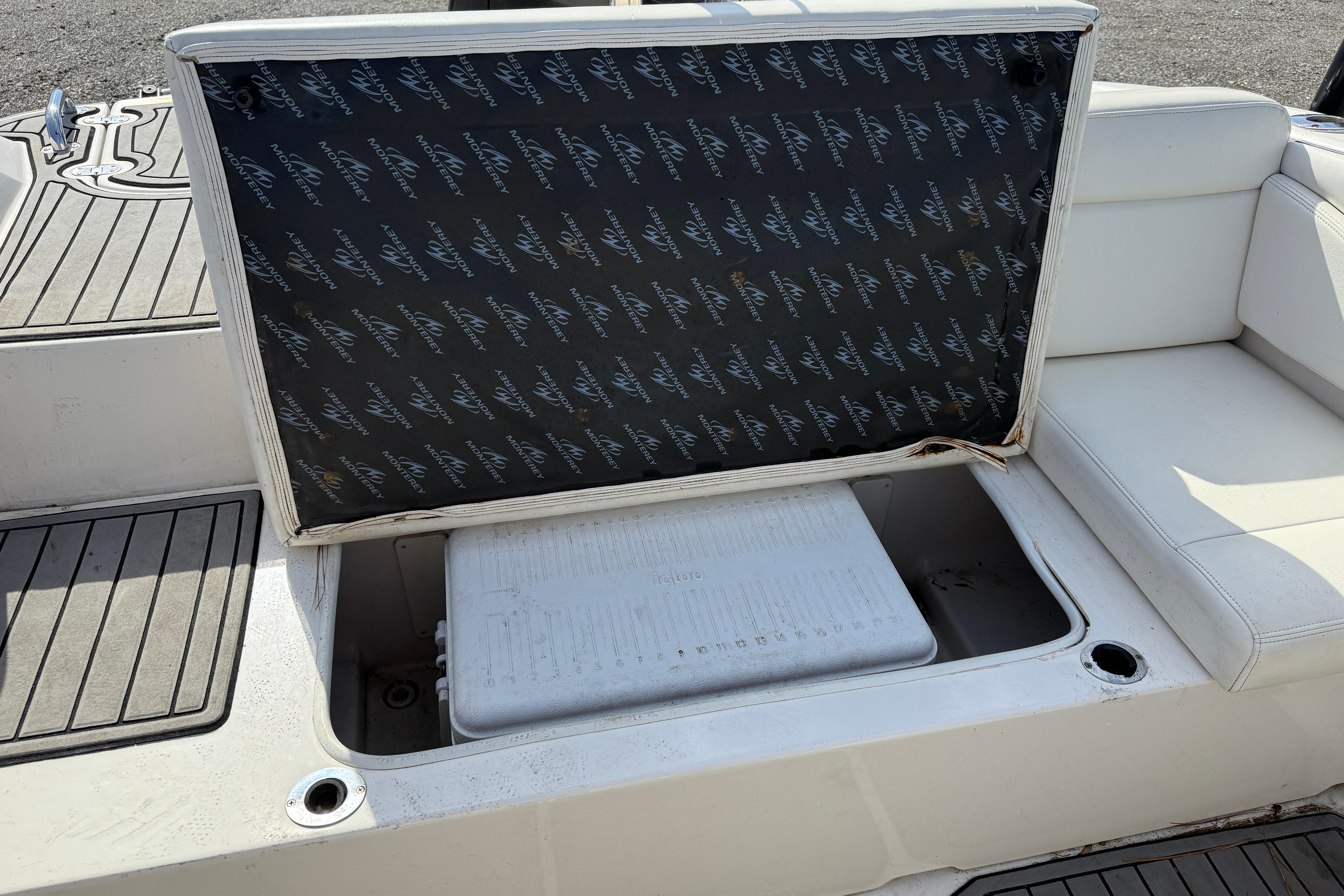 2014 Monterey 197 Blackfin boat seat storage compartment with cooler.
