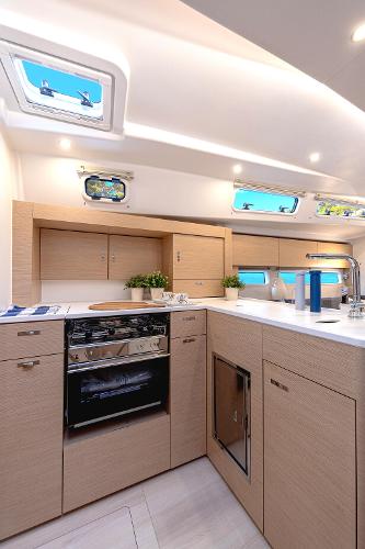 Modern kitchen interior of 2025 Hanse 360 yacht with sleek cabinetry and appliances.