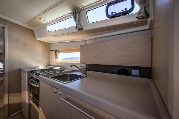 Interior of Beneteau Oceanis 38.1 yacht kitchen, 2021 model.