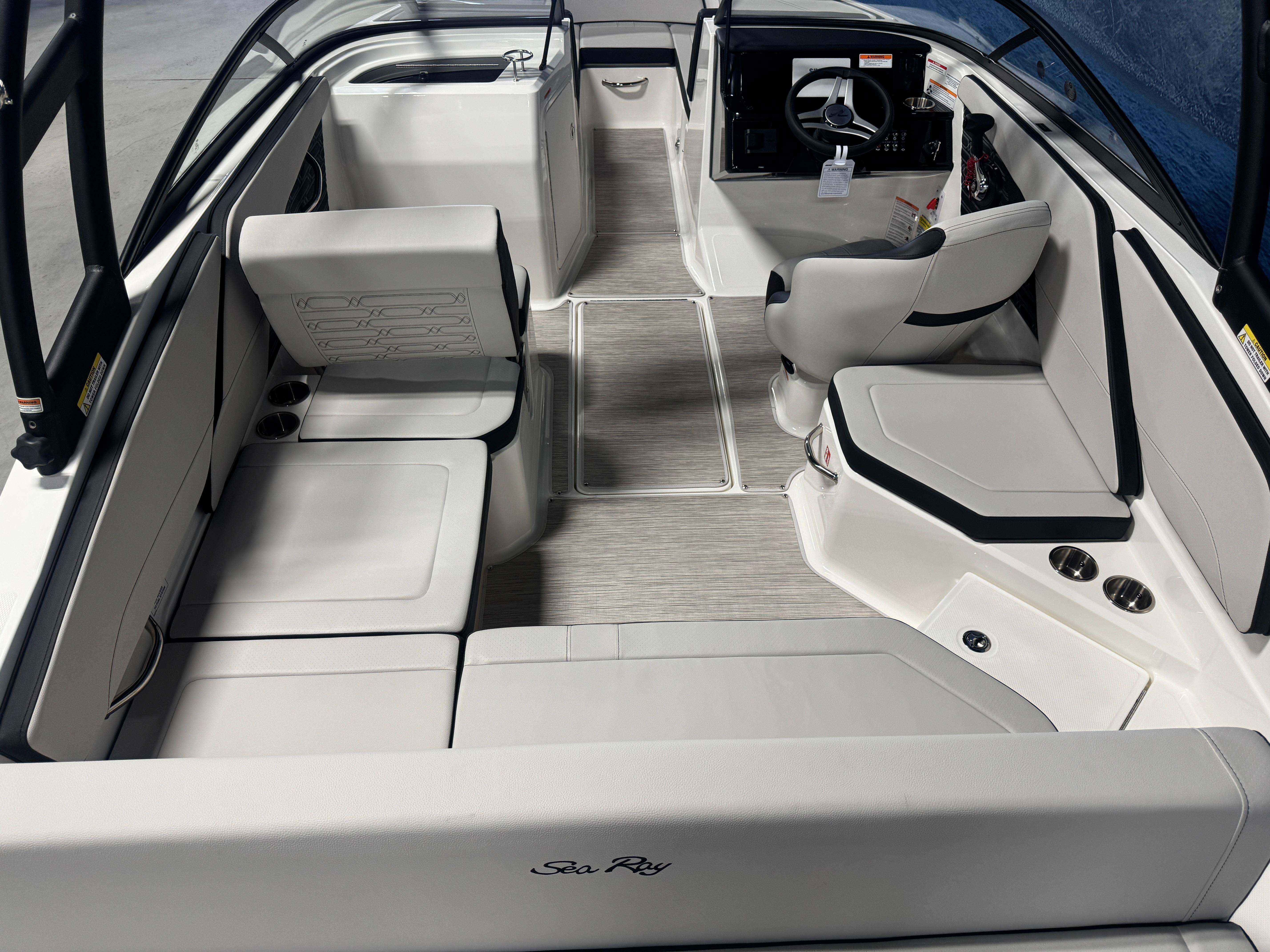 Interior of a 2026 Sea Ray SPX 210 boat with modern seating and steering console.