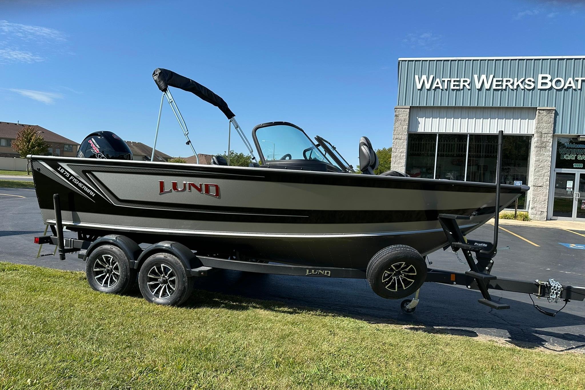 2026 Lund 1875 Fisherman boat on trailer outside Water Werks dealership.