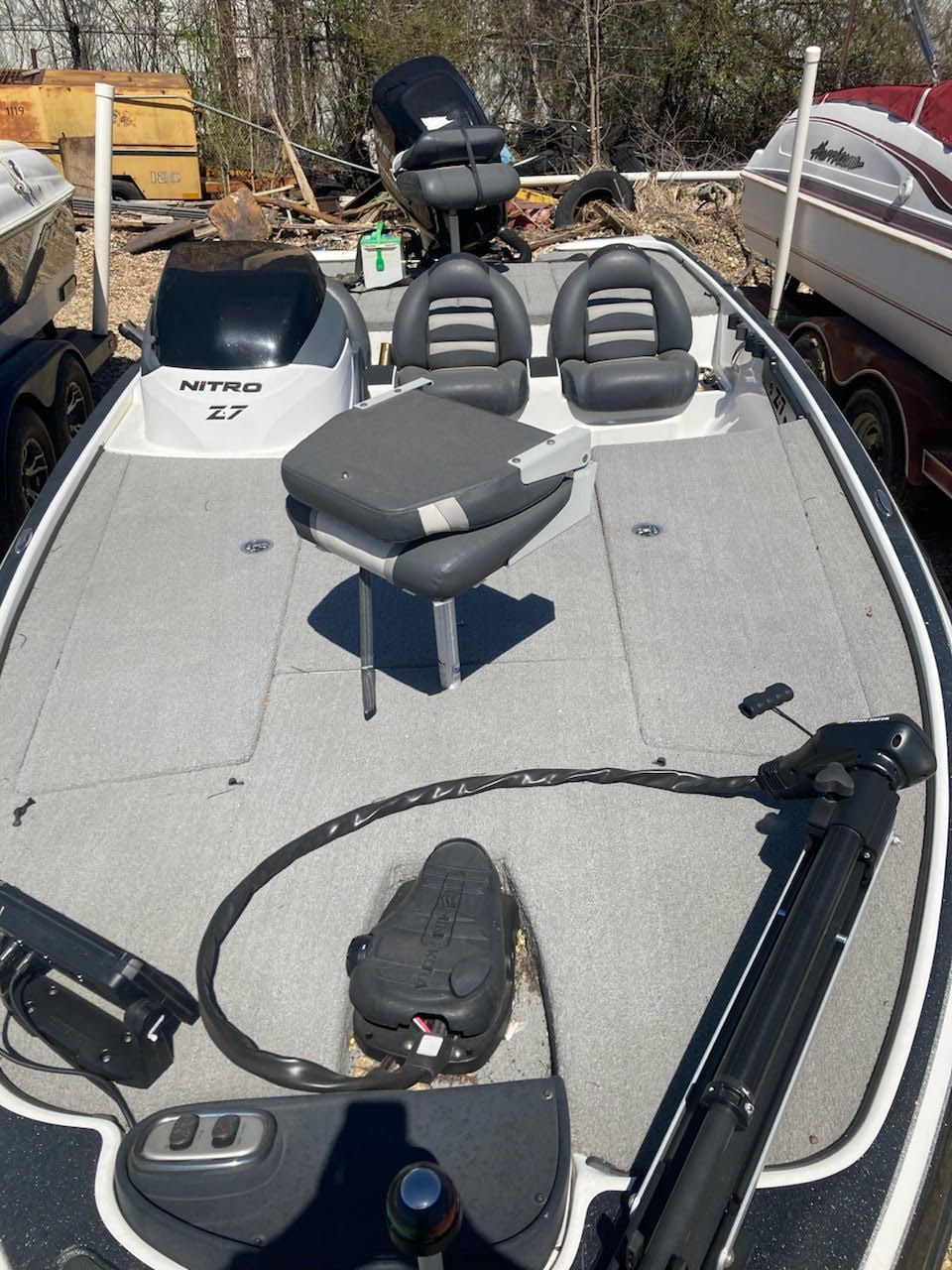 The image shows a 2011 Nitro Z-7 boat with a gray deck and two seats.