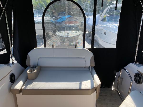 The image shows the cockpit of a 2017 Regal 26 Express boat with seating and windows.