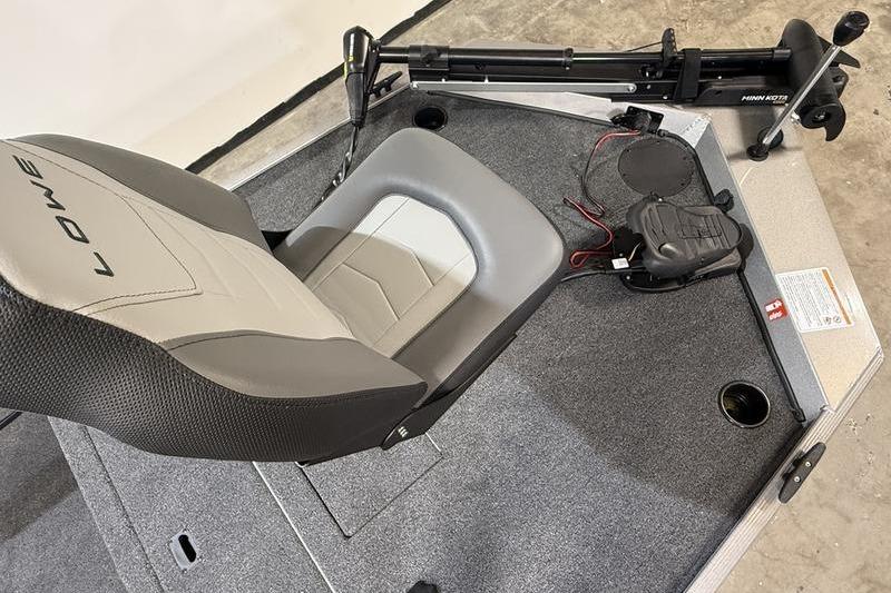 2026 Lowe Skorpion 16 boat interior with seat and trolling motor.