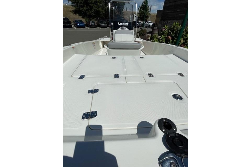 2026 Mako Pro Skiff 17 CC boat interior with storage compartments and seating.