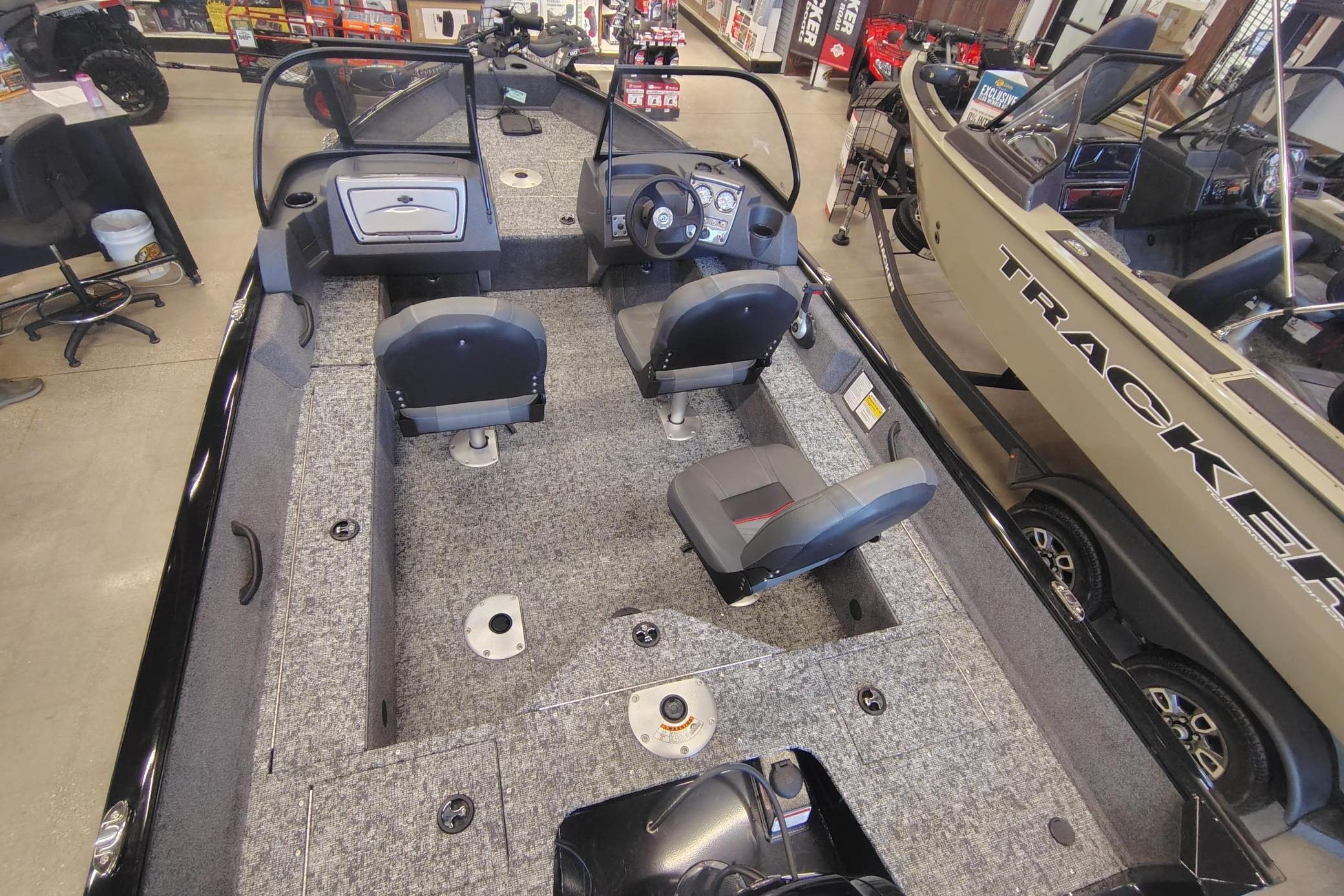 2026 Tracker Pro Guide V-16 WT boat interior with seating and steering console.