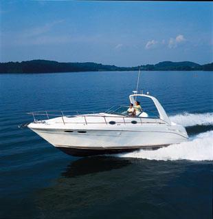 2001 Sea Ray 340 Sundancer cruising on a lake.