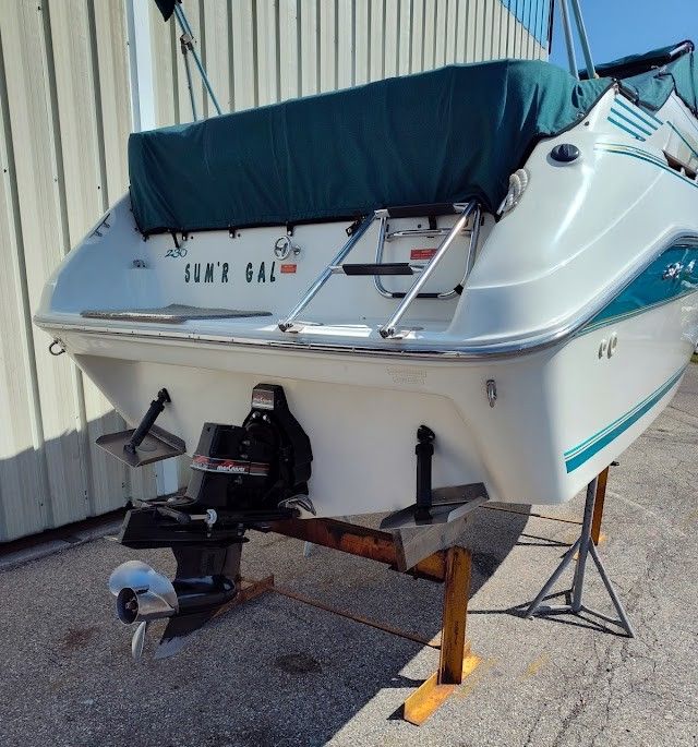 1994 Sea Ray 230 Sundancer boat on stands, rear view.