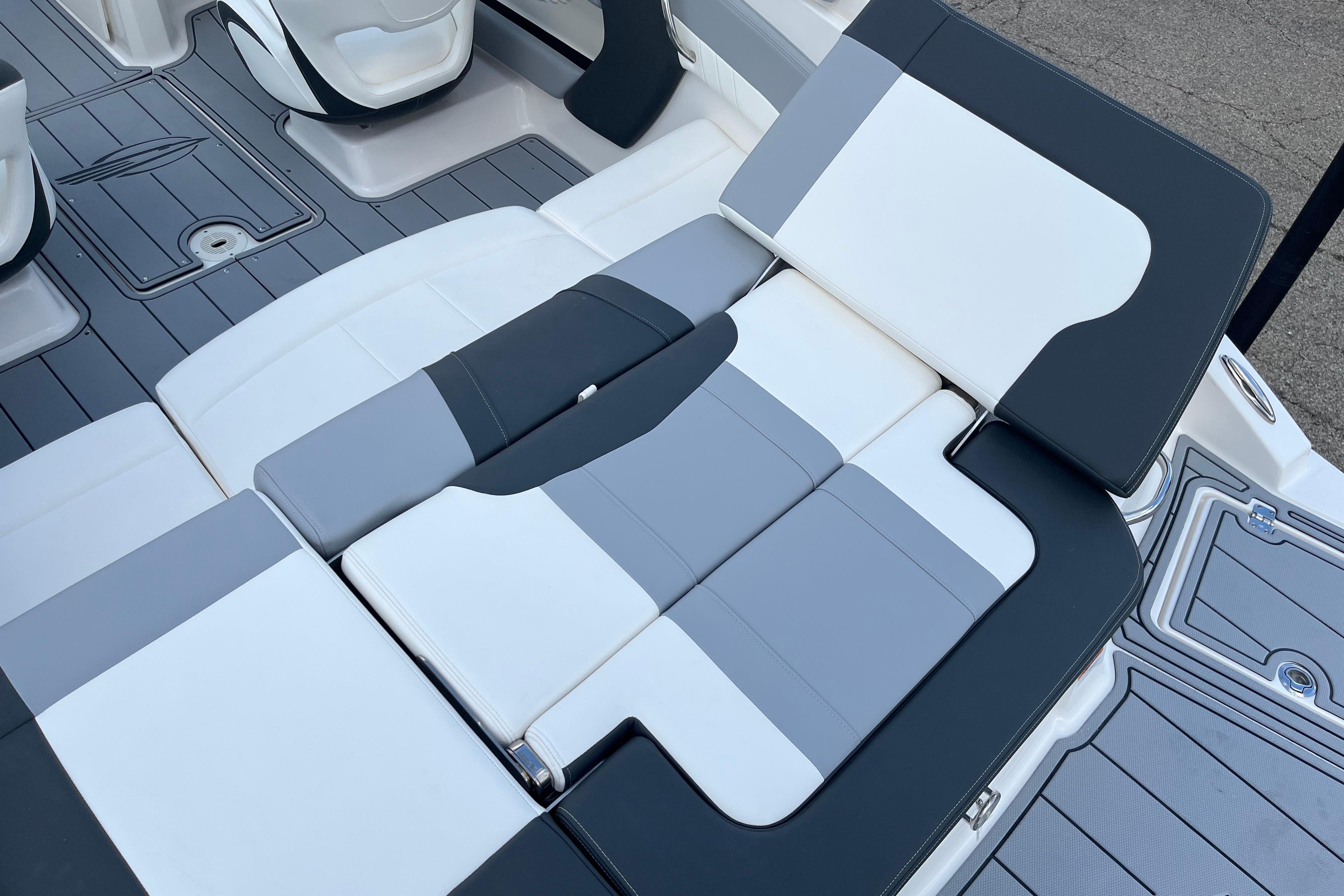 2026 Chaparral 21 SSi boat interior with gray and white seating arrangement.