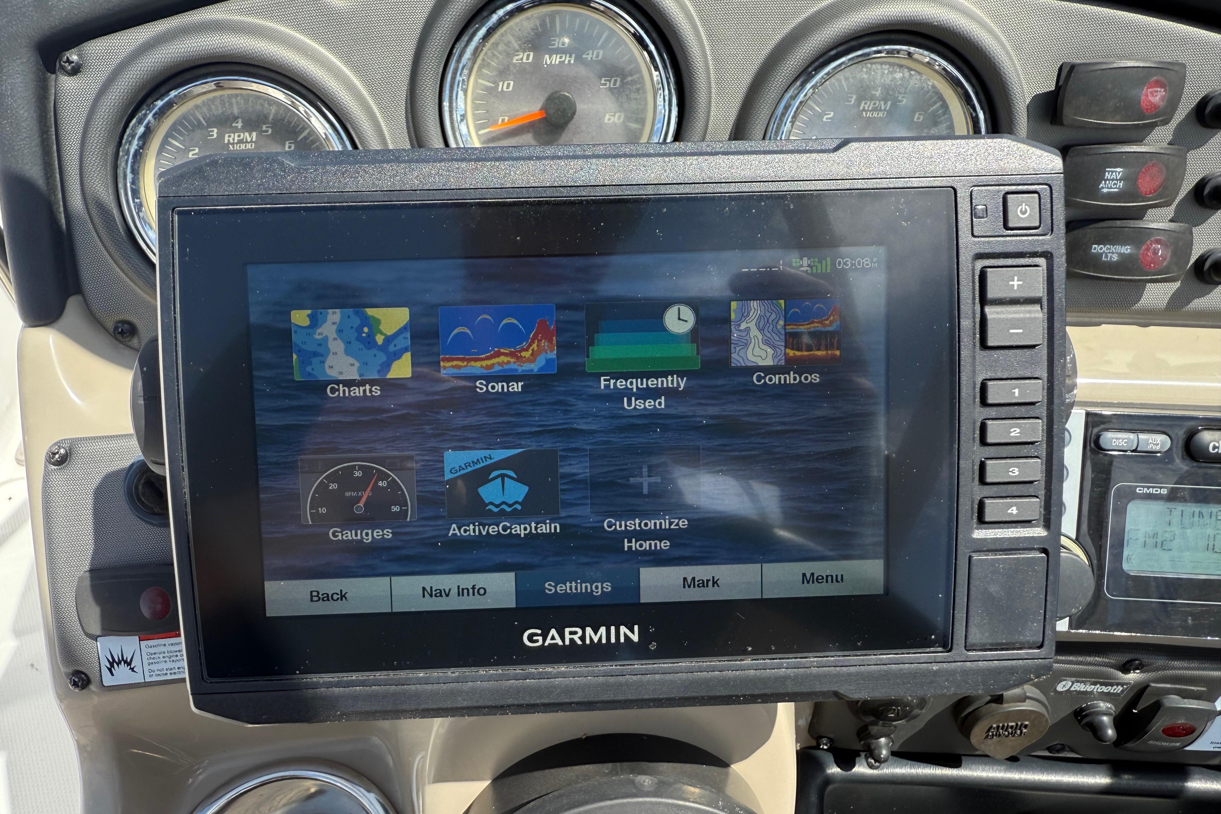 Garmin navigation system on 2014 Yamaha Boats 242 Limited S dashboard, displaying charts and sonar.
