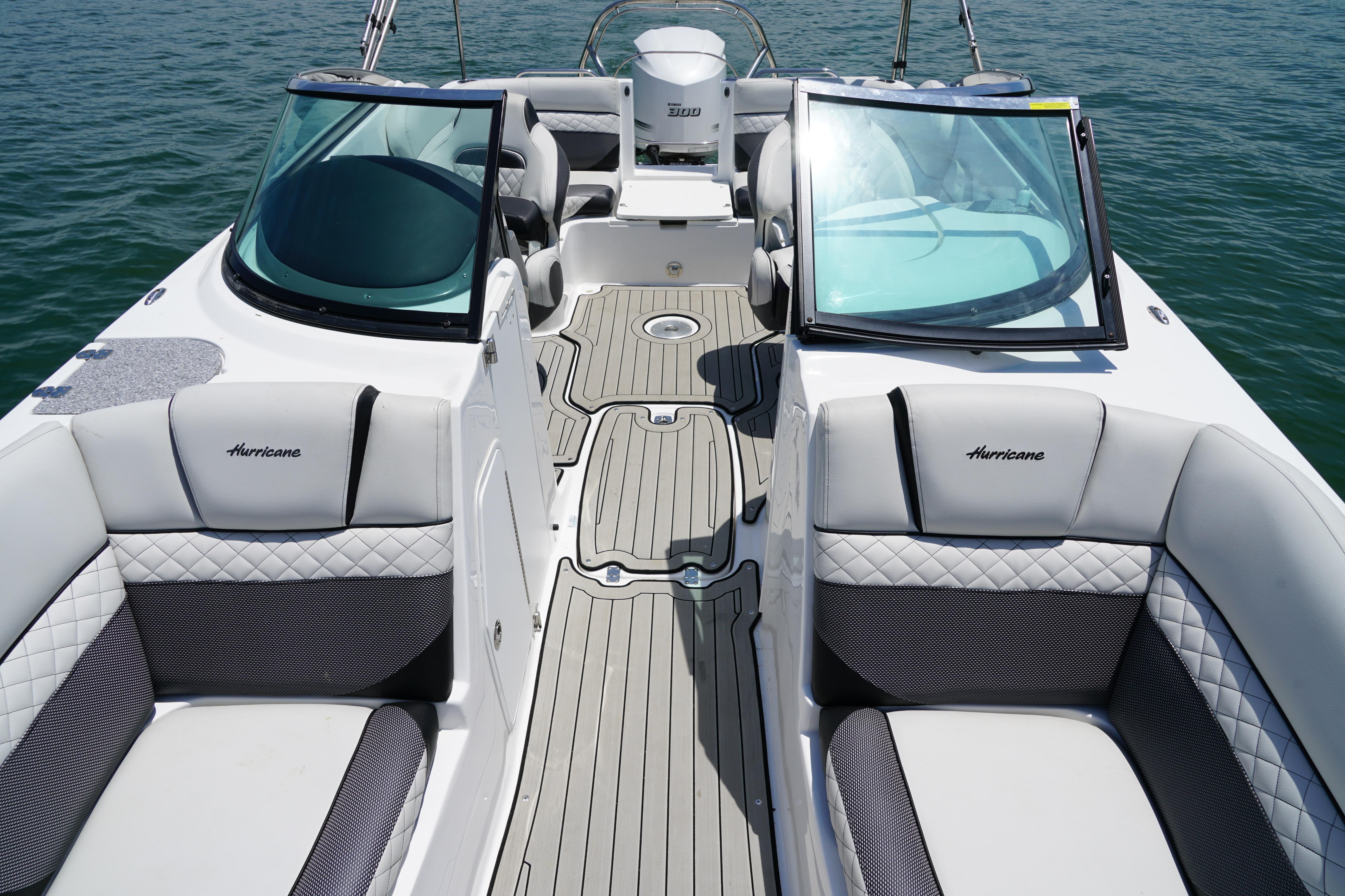 2020 Hurricane SunDeck 2486 OB boat interior with plush seating and open deck layout.