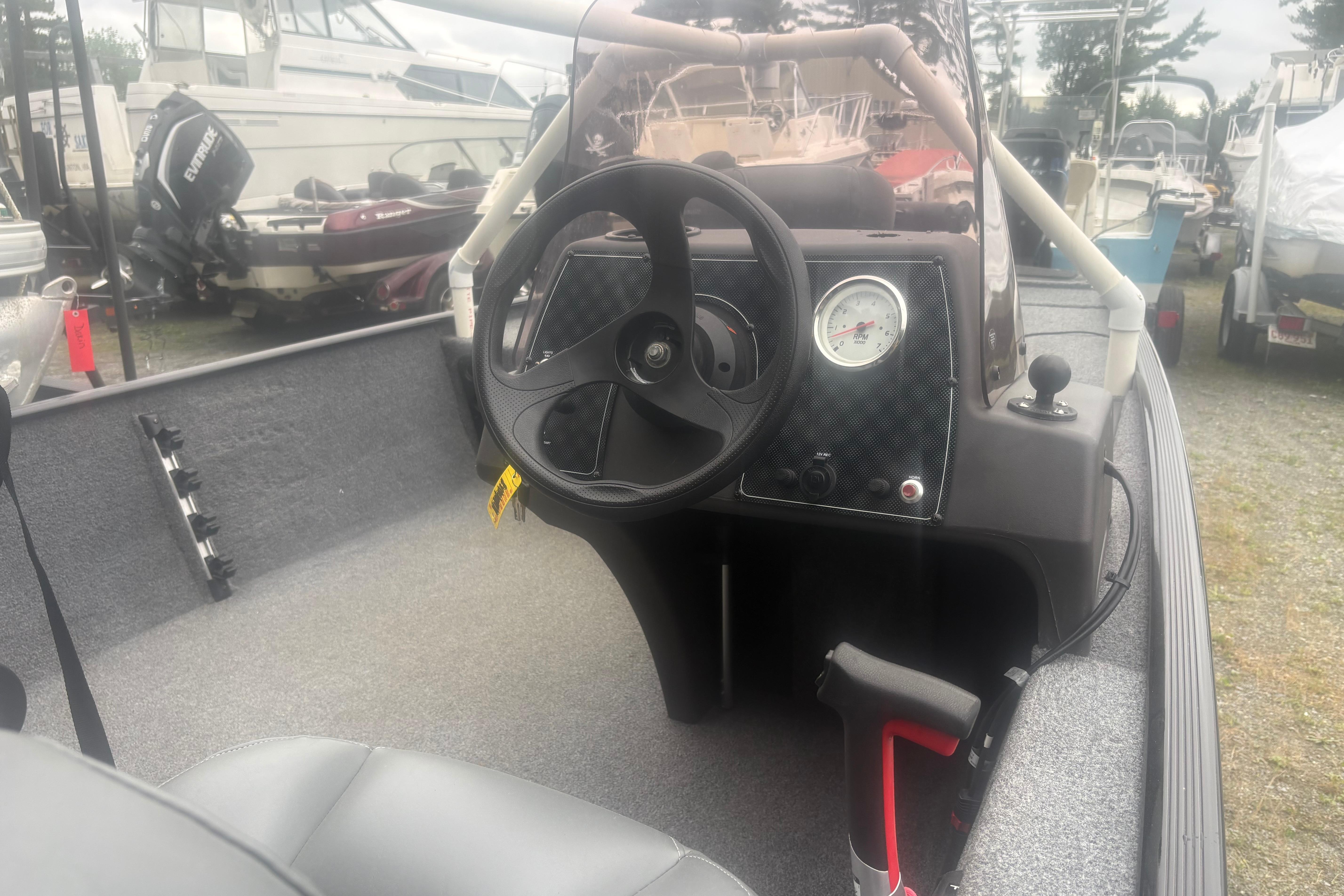 2020 Bass Tracker III Classic boat interior with steering wheel and dashboard controls.