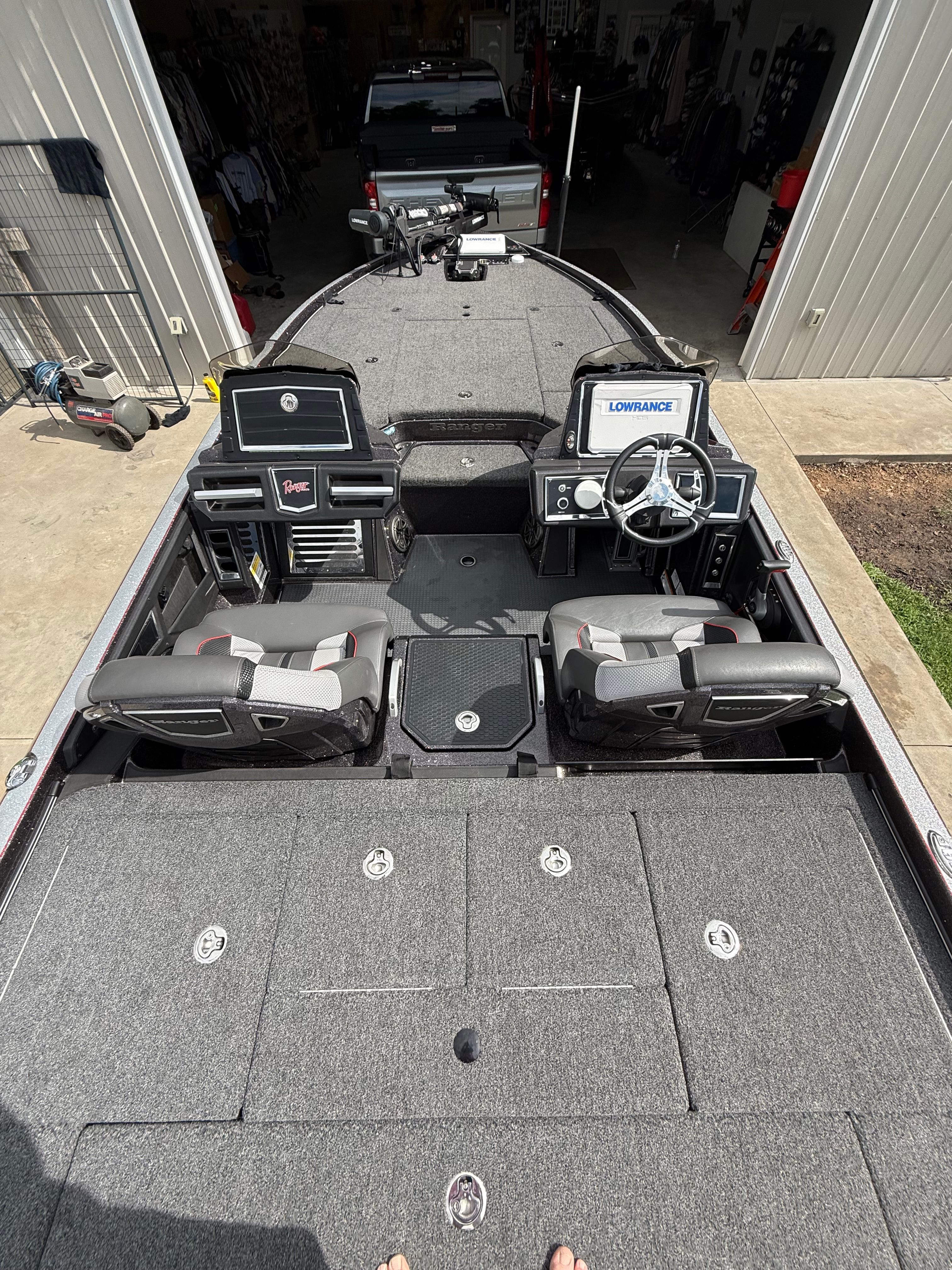 Interior view of a 2024 Ranger Z520R boat in a garage.