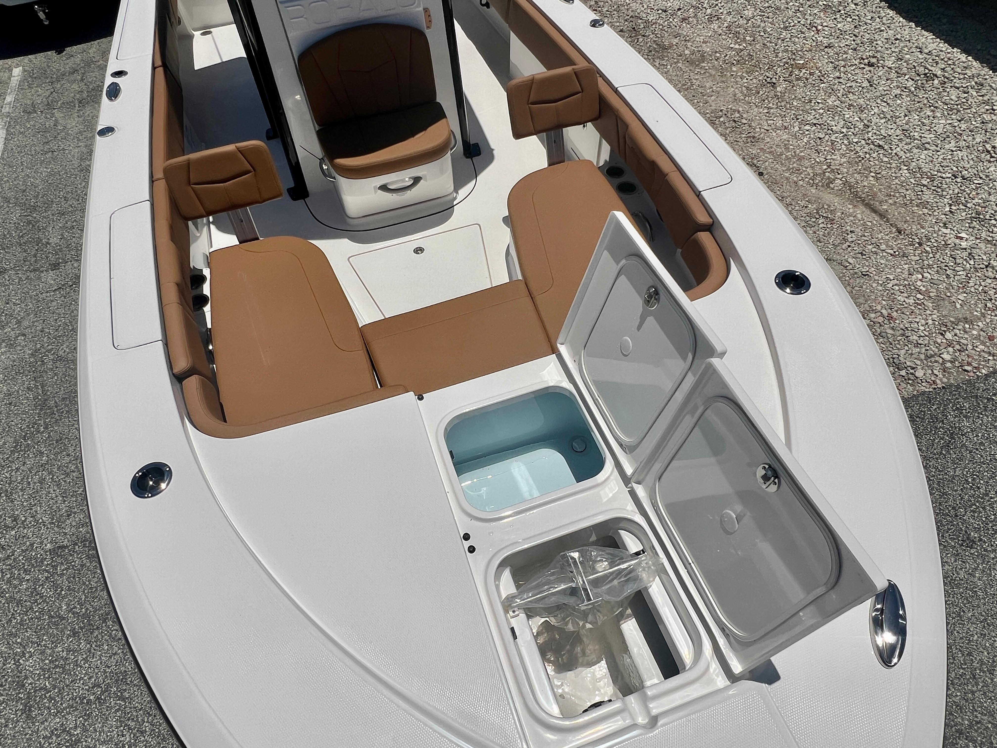 2025 Robalo 266 Cayman with open storage hatch and seating area.