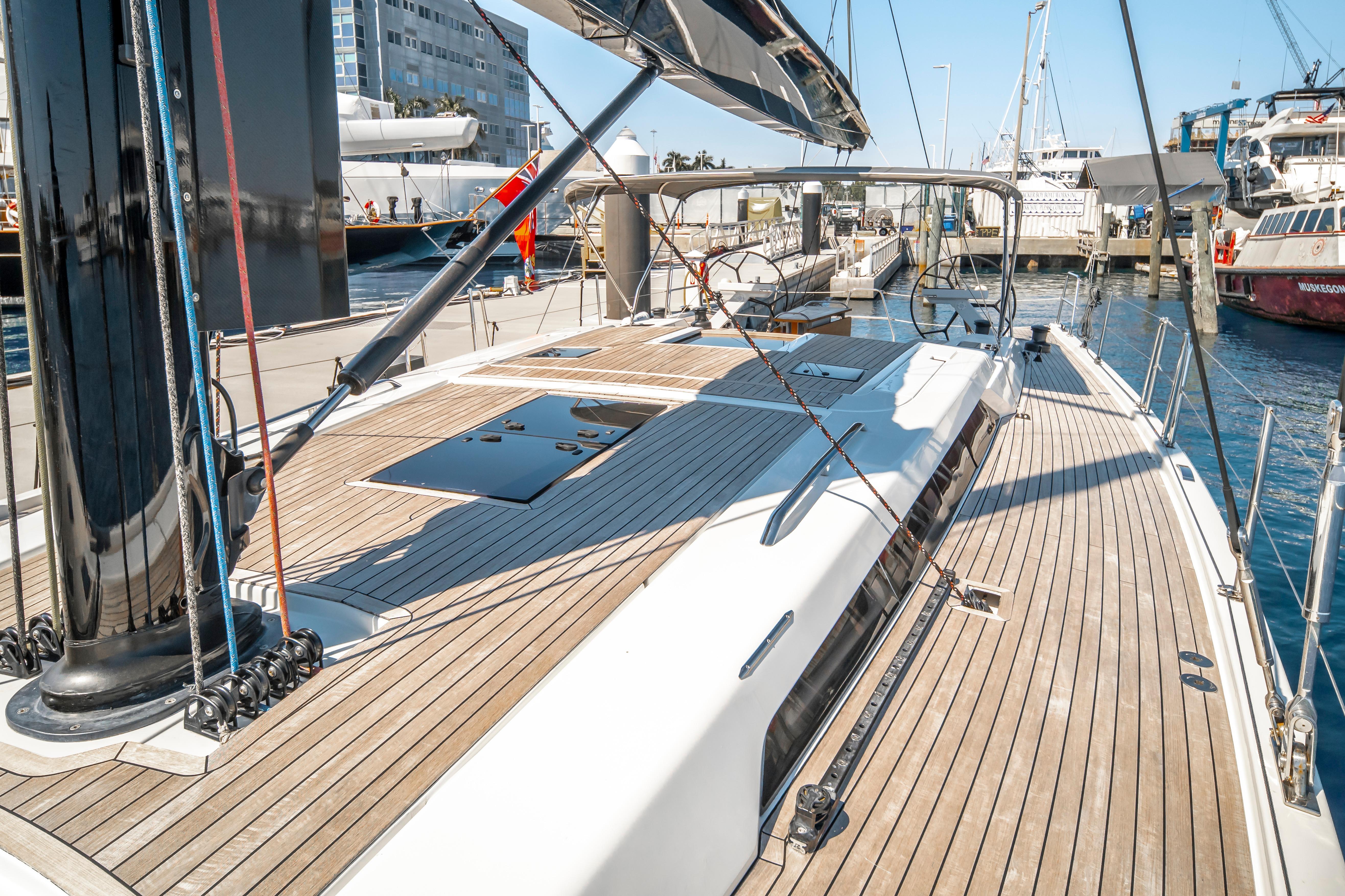 Luxurious 2016 Grand Soleil 58 yacht docked at a marina, showcasing sleek deck design.
