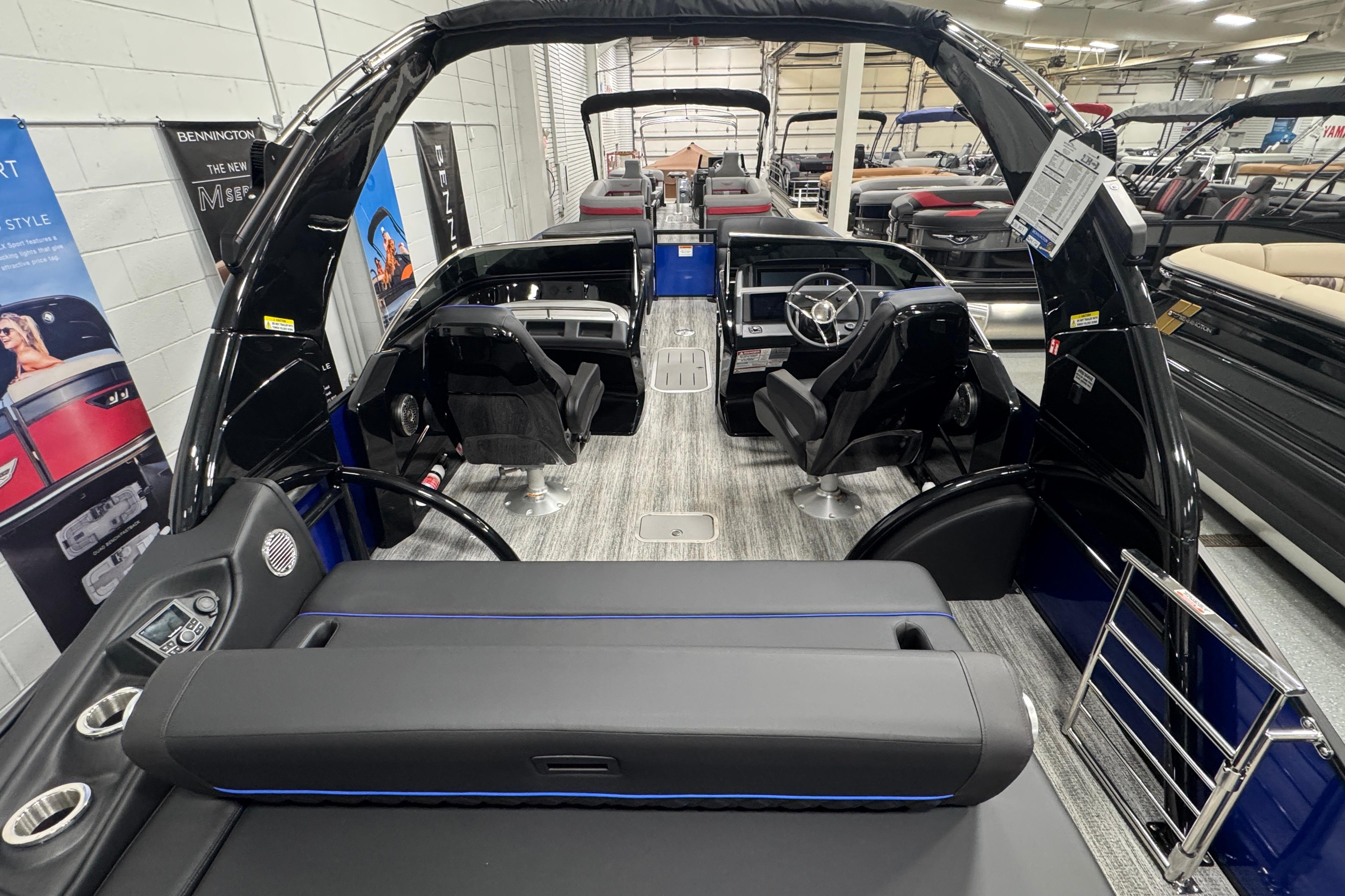 2026 Bennington 25 QSBWASE pontoon boat interior with modern seating and steering console.