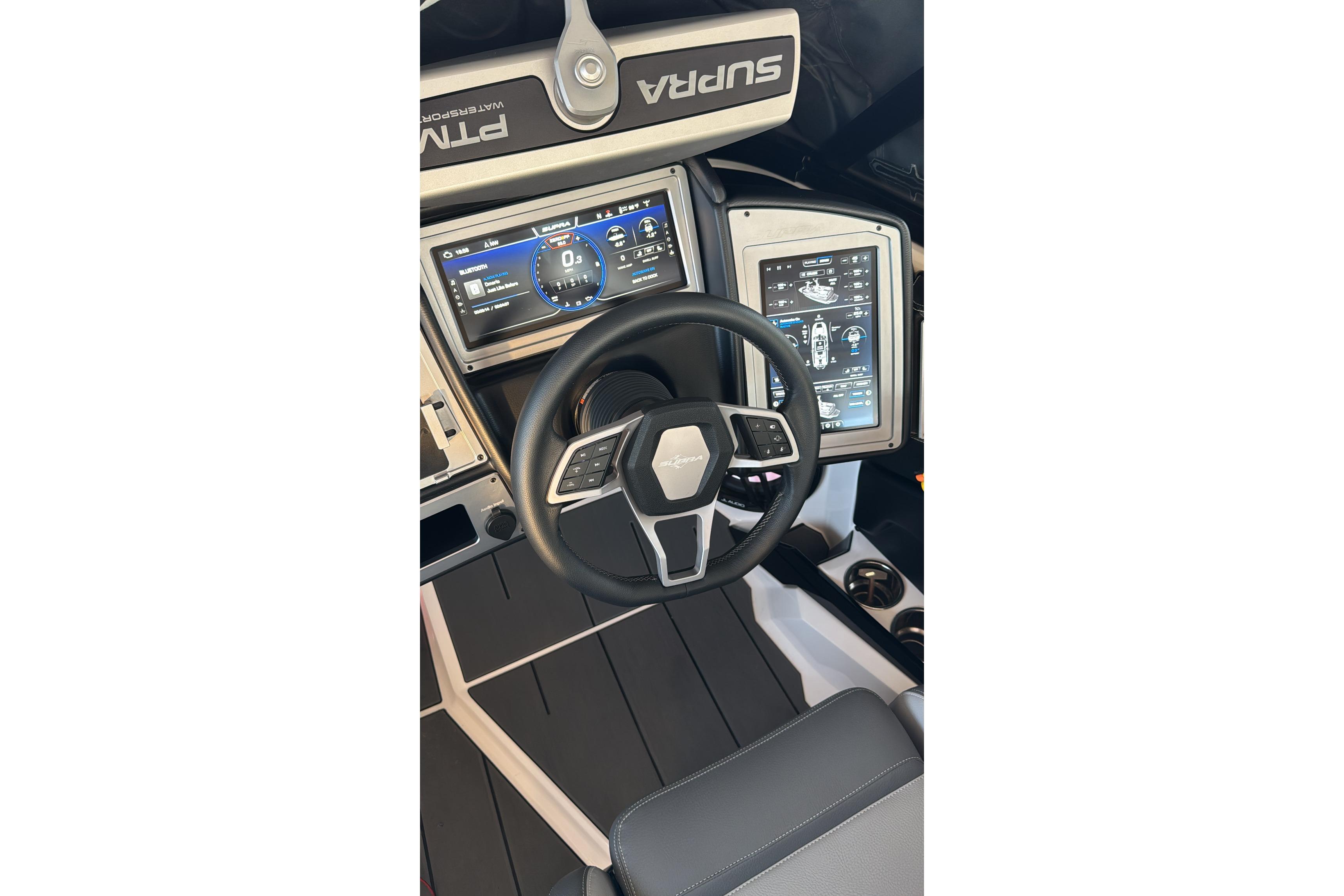 2023 Supra SE 550 dashboard with advanced digital displays and steering wheel.